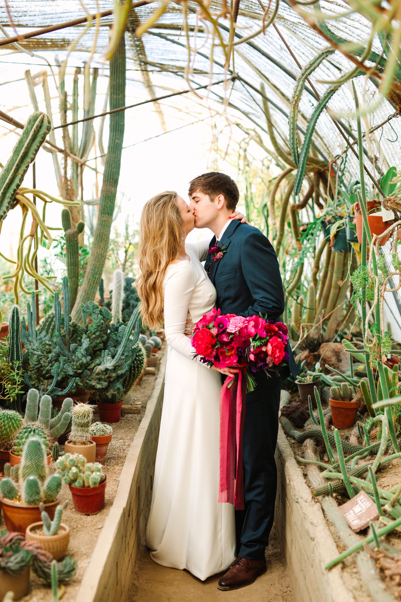 Bride and groom at Moorten Botanical Garden | Colorful jewel tone Palm Springs elopement | Fresh and colorful photography for fun-loving couples in Southern California | #colorfulelopement #palmspringselopement #elopementphotography #palmspringswedding Source: Mary Costa Photography | Los Angeles