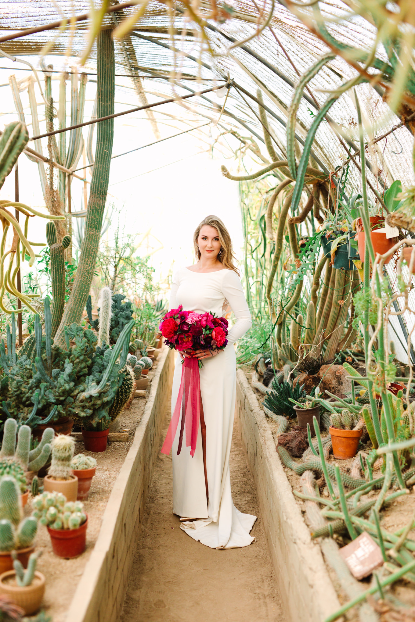 Bridal portrait in Moorten Botanical Garden greenhouse | Colorful jewel tone Palm Springs elopement | Fresh and colorful photography for fun-loving couples in Southern California | #colorfulelopement #palmspringselopement #elopementphotography #palmspringswedding Source: Mary Costa Photography | Los Angeles