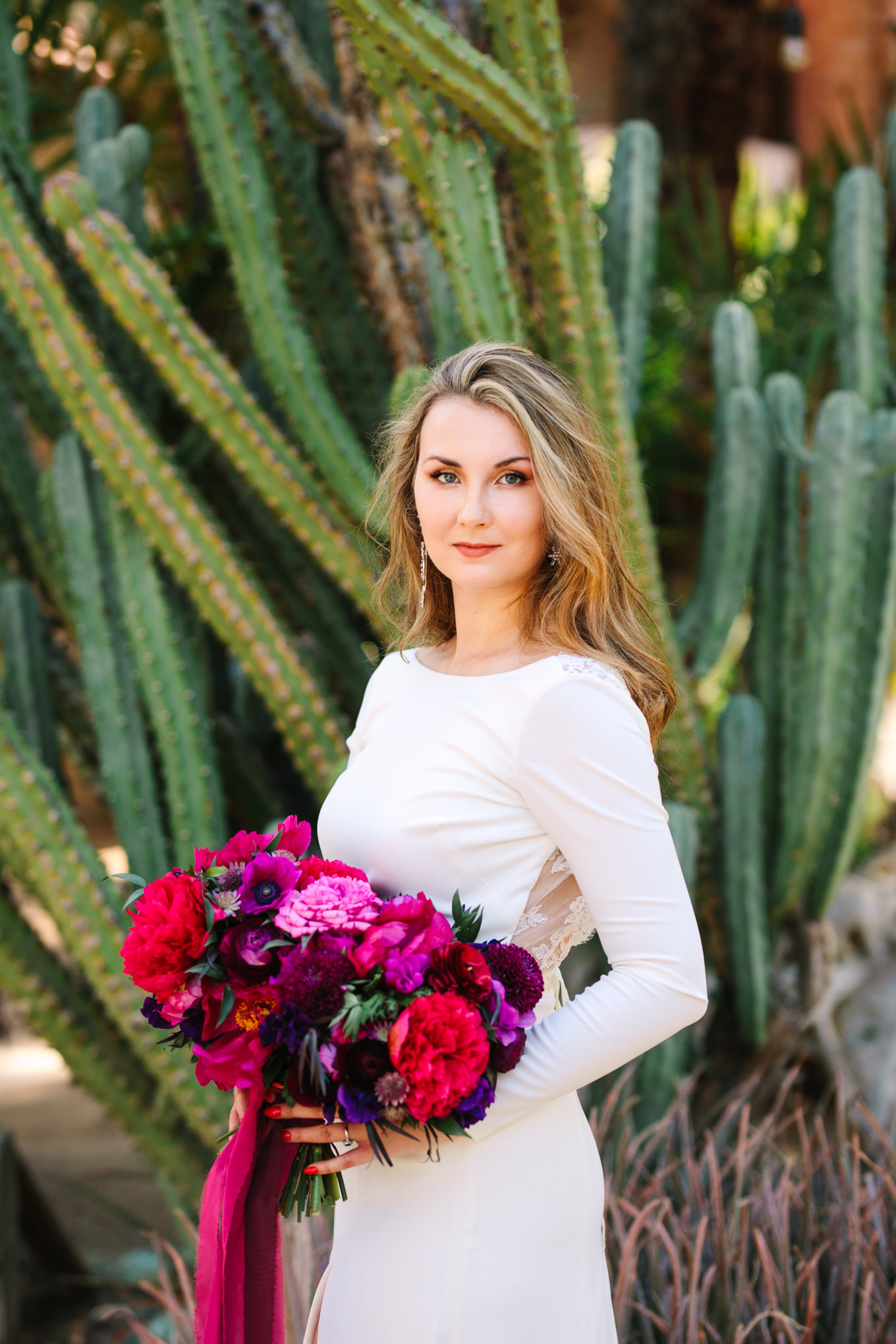 Bridal portrait at Moorten Botanical Garden | Colorful jewel tone Palm Springs elopement | Fresh and colorful photography for fun-loving couples in Southern California | #colorfulelopement #palmspringselopement #elopementphotography #palmspringswedding Source: Mary Costa Photography | Los Angeles