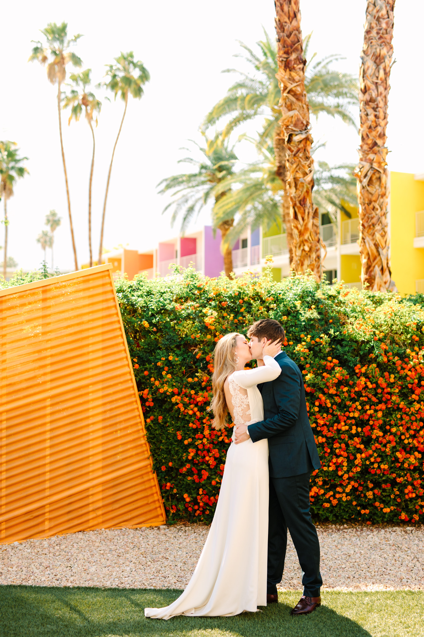 First kiss during wedding ceremony at Saguaro Palm Springs | Colorful jewel tone Palm Springs elopement | Fresh and colorful photography for fun-loving couples in Southern California | #colorfulelopement #palmspringselopement #elopementphotography #palmspringswedding Source: Mary Costa Photography | Los Angeles