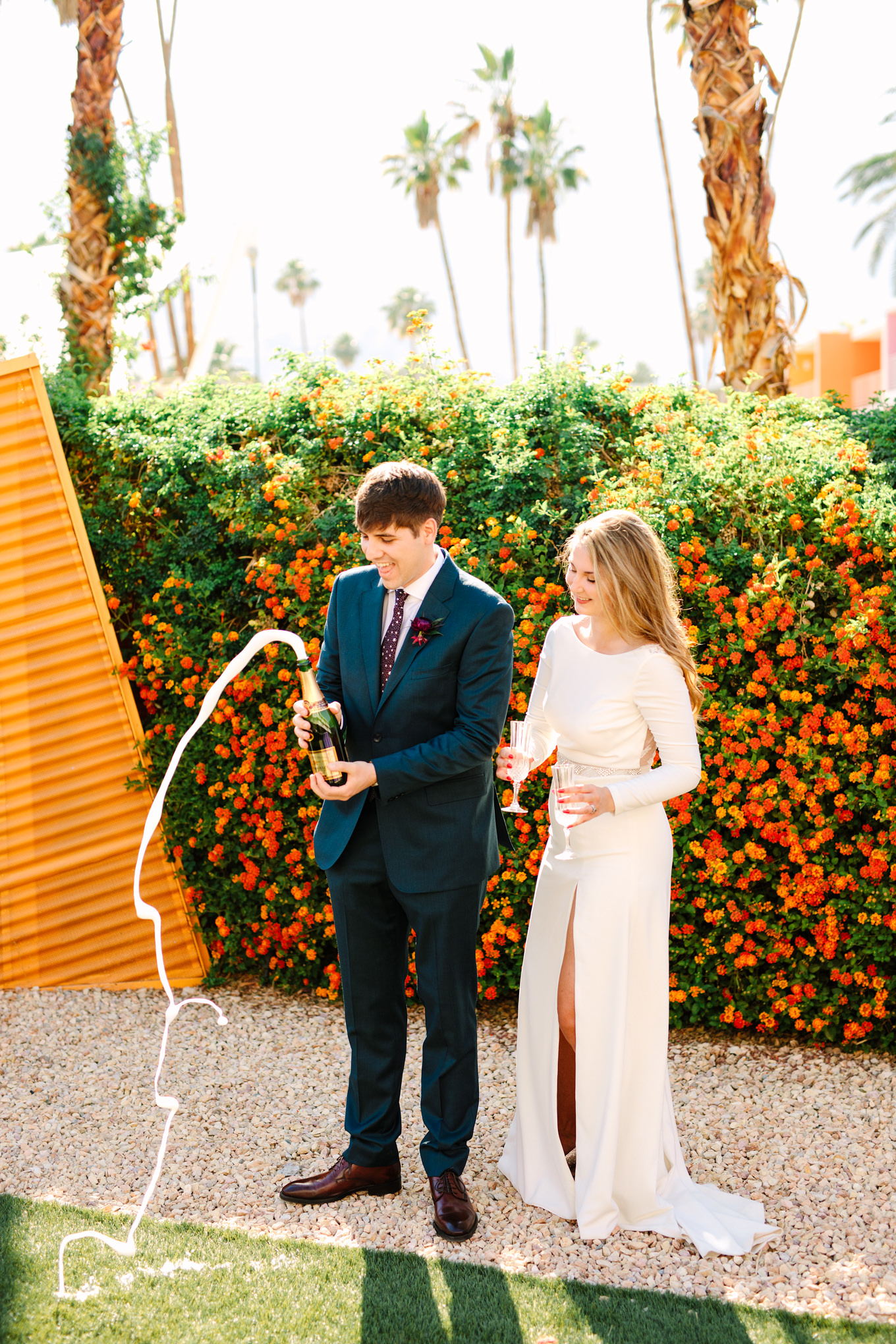 Champagne pop at Saguaro Palm Springs | Colorful jewel tone Palm Springs elopement | Fresh and colorful photography for fun-loving couples in Southern California | #colorfulelopement #palmspringselopement #elopementphotography #palmspringswedding Source: Mary Costa Photography | Los Angeles