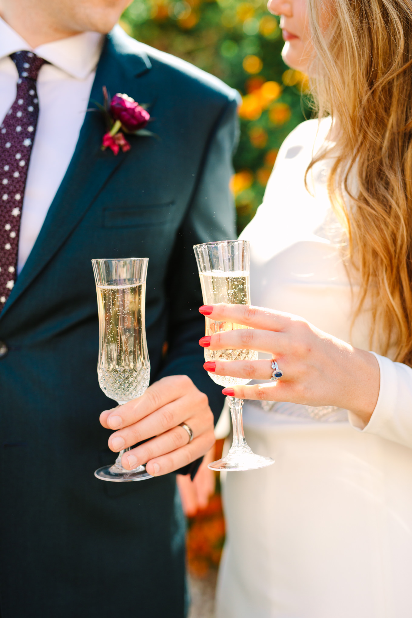 Bride and groom drinking champagne at Saguaro Palm Springs | Colorful jewel tone Palm Springs elopement | Fresh and colorful photography for fun-loving couples in Southern California | #colorfulelopement #palmspringselopement #elopementphotography #palmspringswedding Source: Mary Costa Photography | Los Angeles