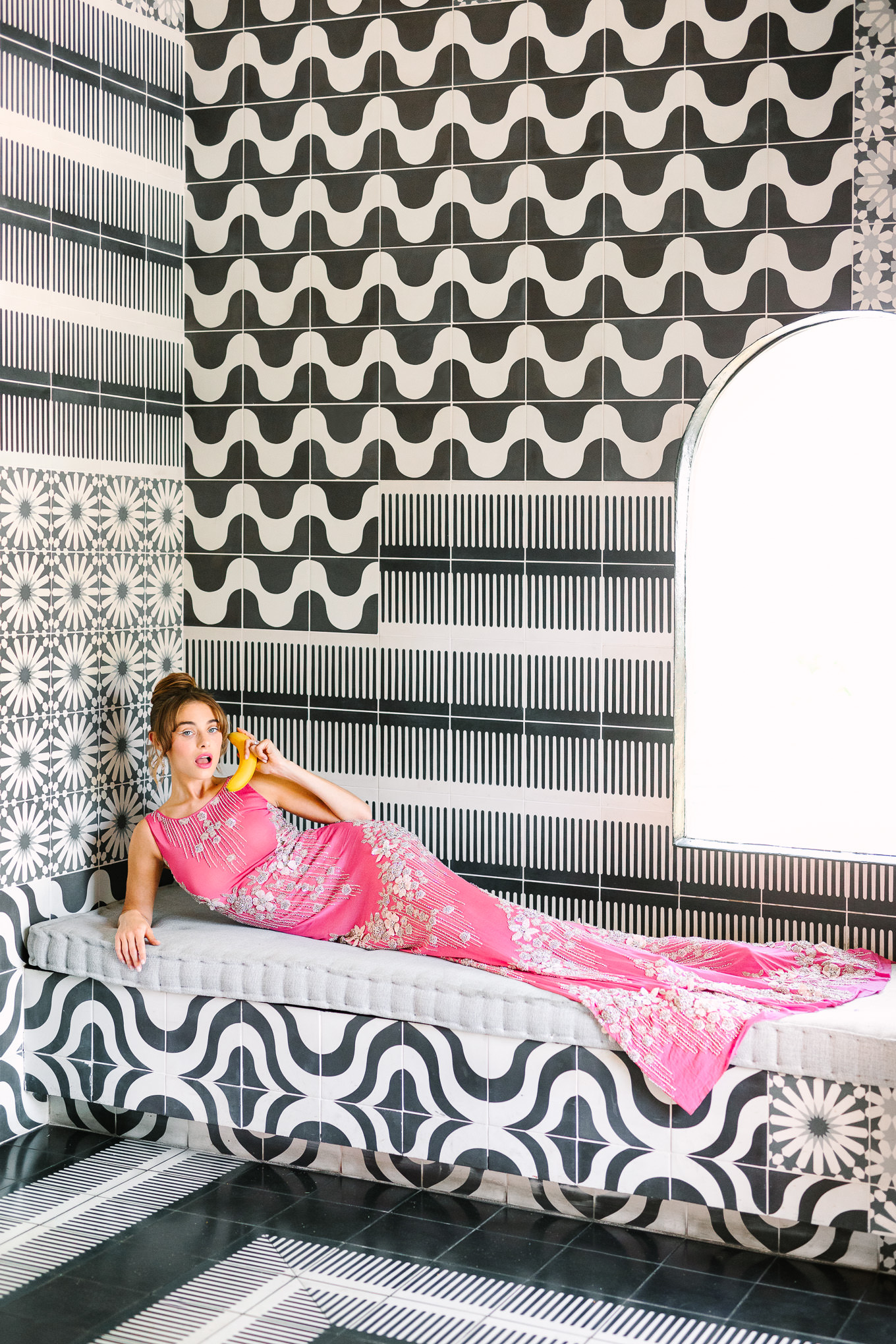 Naeem Khan pink dress banana phone in Sands Hotel tile lobby | Kindred Presets x Mary Costa Photography Sands Hotel Ad Campaign | Colorful Palm Springs wedding photography | #palmspringsphotographer #lightroompresets #sandshotel #pinkhotel   Source: Mary Costa Photography | Los Angeles