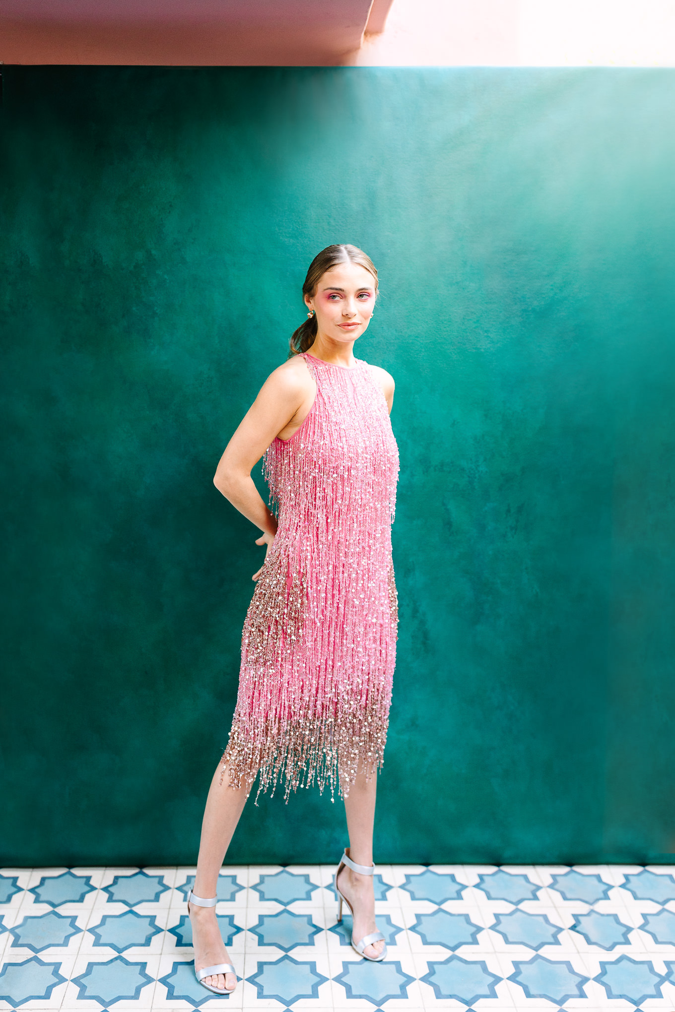 Pink fringe Naeem Khan gown on emerald backdrop | Kindred Presets x Mary Costa Photography Sands Hotel Ad Campaign | Colorful Palm Springs wedding photography | #palmspringsphotographer #lightroompresets #sandshotel #pinkhotel   Source: Mary Costa Photography | Los Angeles