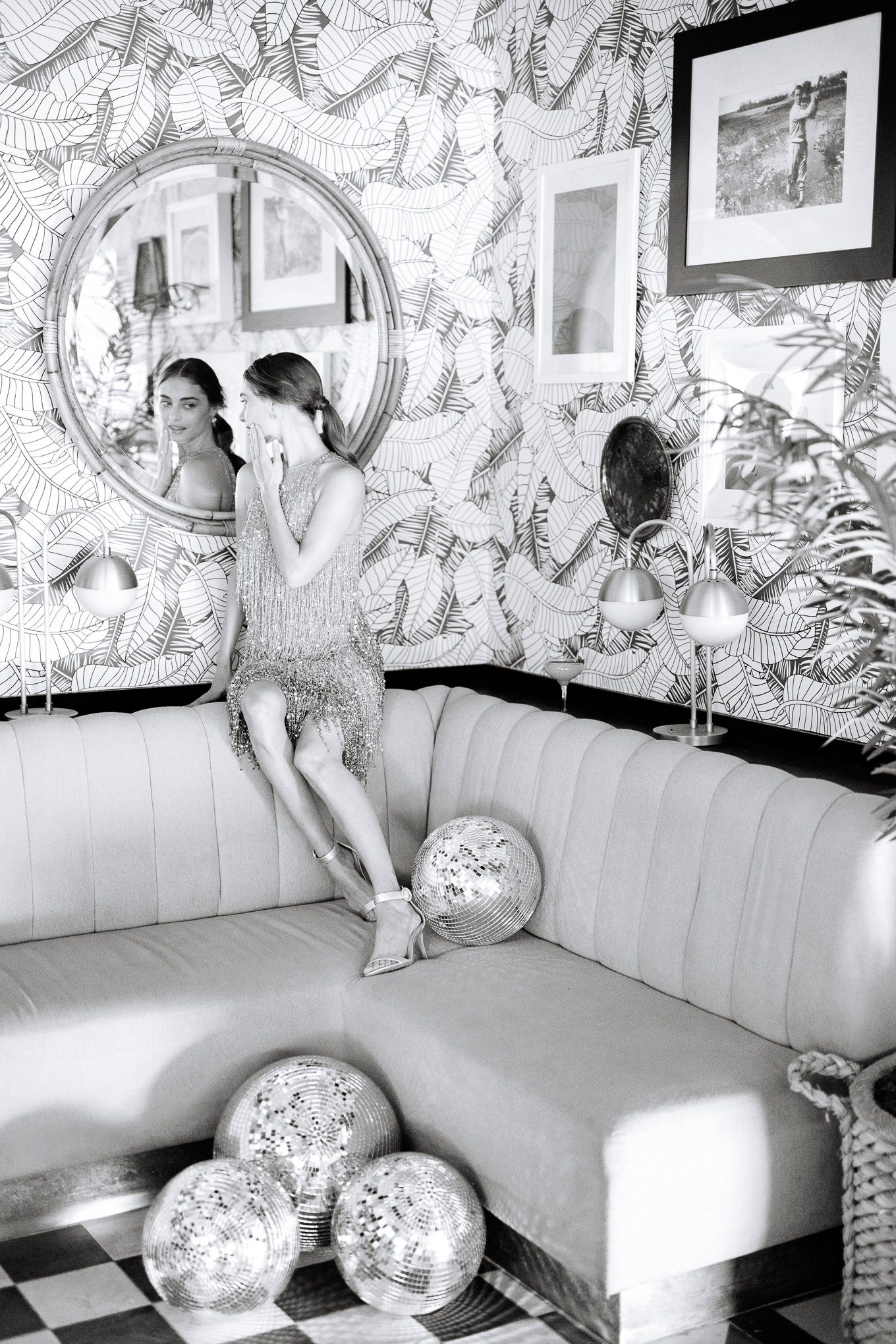 Black and white disco ball photo in Pink Cabana Restaurant | Kindred Presets x Mary Costa Photography Sands Hotel Ad Campaign | Colorful Palm Springs wedding photography | #palmspringsphotographer #lightroompresets #sandshotel #pinkhotel   Source: Mary Costa Photography | Los Angeles