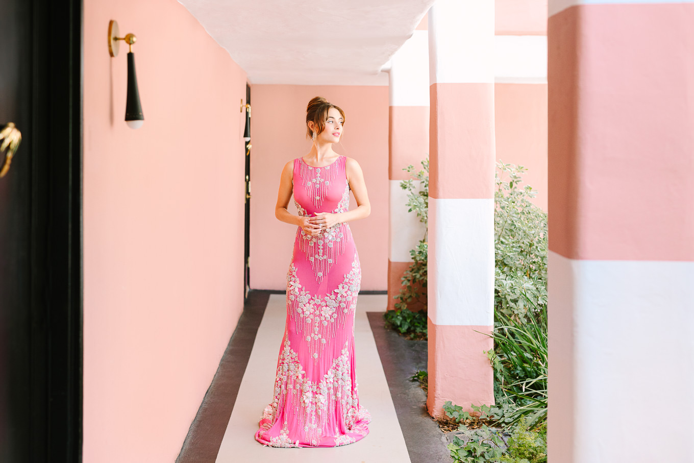 Naeem Khan pink gown in pink Sands Hotel hallway | Kindred Presets x Mary Costa Photography Sands Hotel Ad Campaign | Colorful Palm Springs wedding photography | #palmspringsphotographer #lightroompresets #sandshotel #pinkhotel   Source: Mary Costa Photography | Los Angeles
