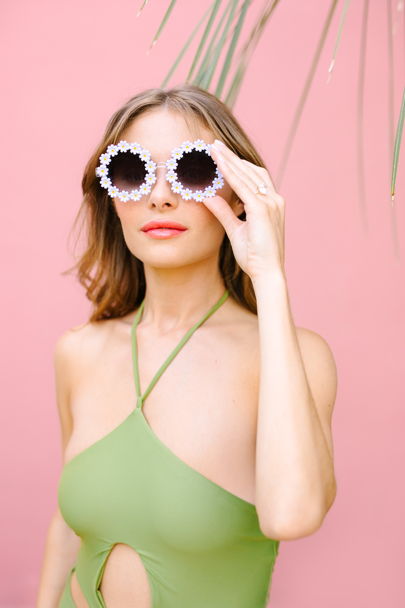 Flower cutout Cult Gaia bathing suit and Elton John flower sunglasses | Kindred Presets x Mary Costa Photography Sands Hotel Ad Campaign | Colorful Palm Springs wedding photography | #palmspringsphotographer #lightroompresets #sandshotel #pinkhotel   Source: Mary Costa Photography | Los Angeles