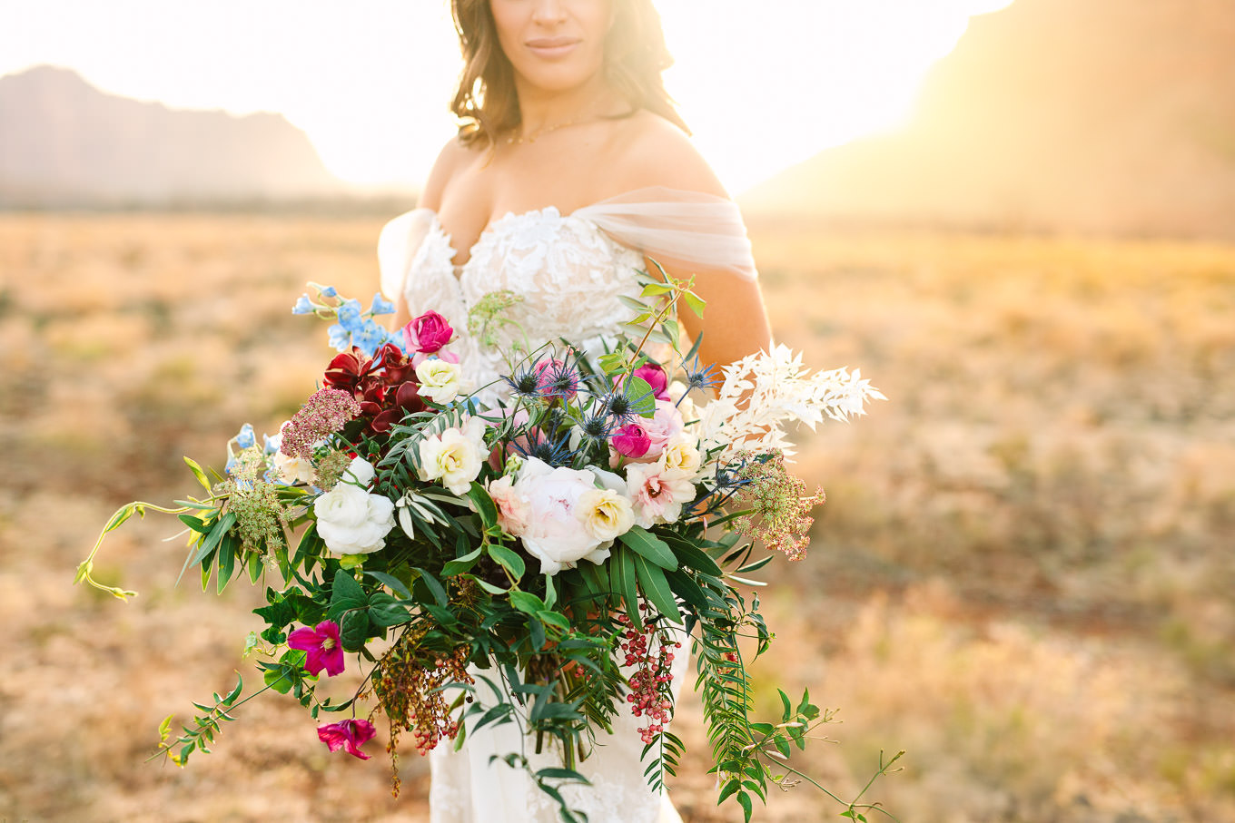 Lush and colorful bride bouquet | Zion Under Canvas Elopement at Sunrise | Colorful adventure elopement photography | #utahelopement #zionelopement #zionwedding #undercanvaszion   Source: Mary Costa Photography | Los Angeles