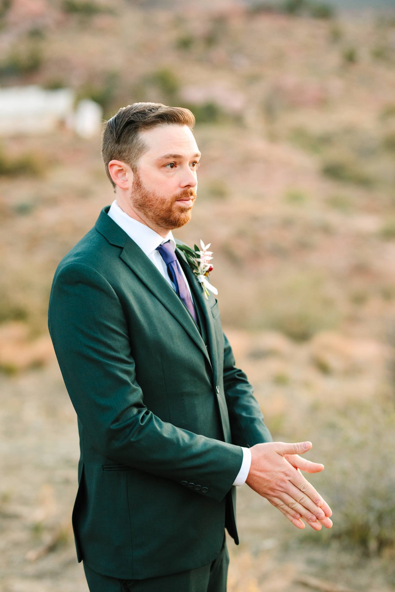 Groom awaiting first look | Zion Under Canvas Elopement at Sunrise | Colorful adventure elopement photography | #utahelopement #zionelopement #zionwedding #undercanvaszion #sunriseelopement  Source: Mary Costa Photography | Los Angeles