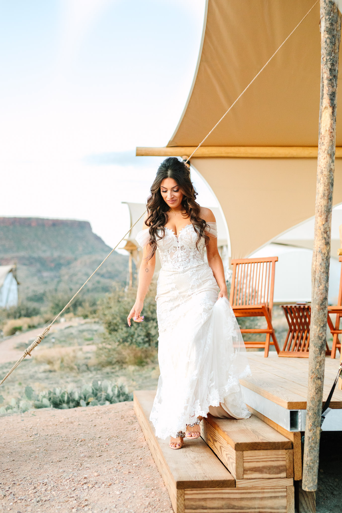 Bride walking from tent to first look at sunrise | Zion Under Canvas Elopement at Sunrise | Colorful adventure elopement photography | #utahelopement #zionelopement #zionwedding #undercanvaszion #sunriseelopement  Source: Mary Costa Photography | Los Angeles