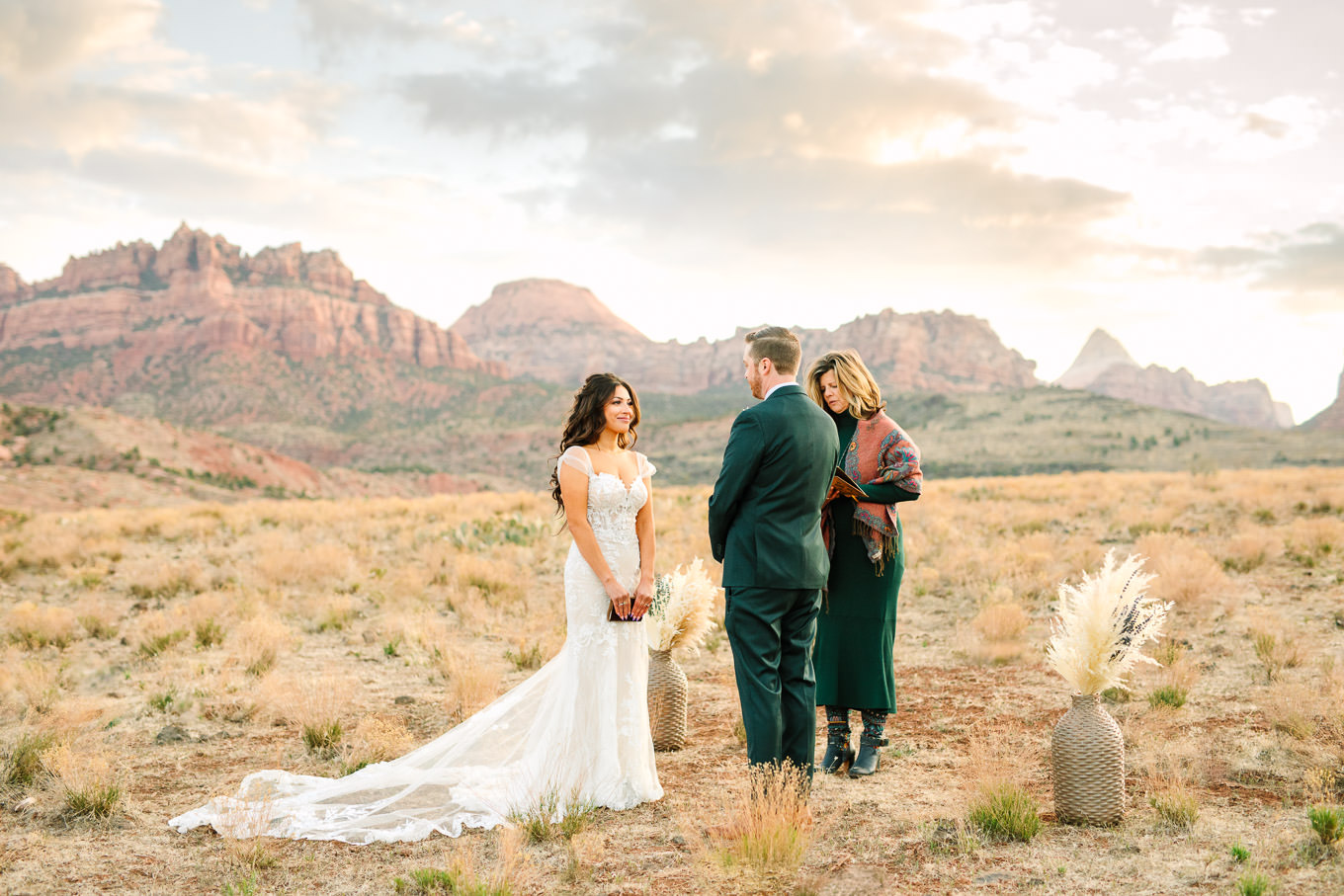 Open field mountain ceremony | Zion Under Canvas camping elopement at sunrise | Colorful elopement photography | #utahelopement #zionelopement #zionwedding #undercanvaszion #sunriseelopement #adventureelopement  Source: Mary Costa Photography | Los Angeles