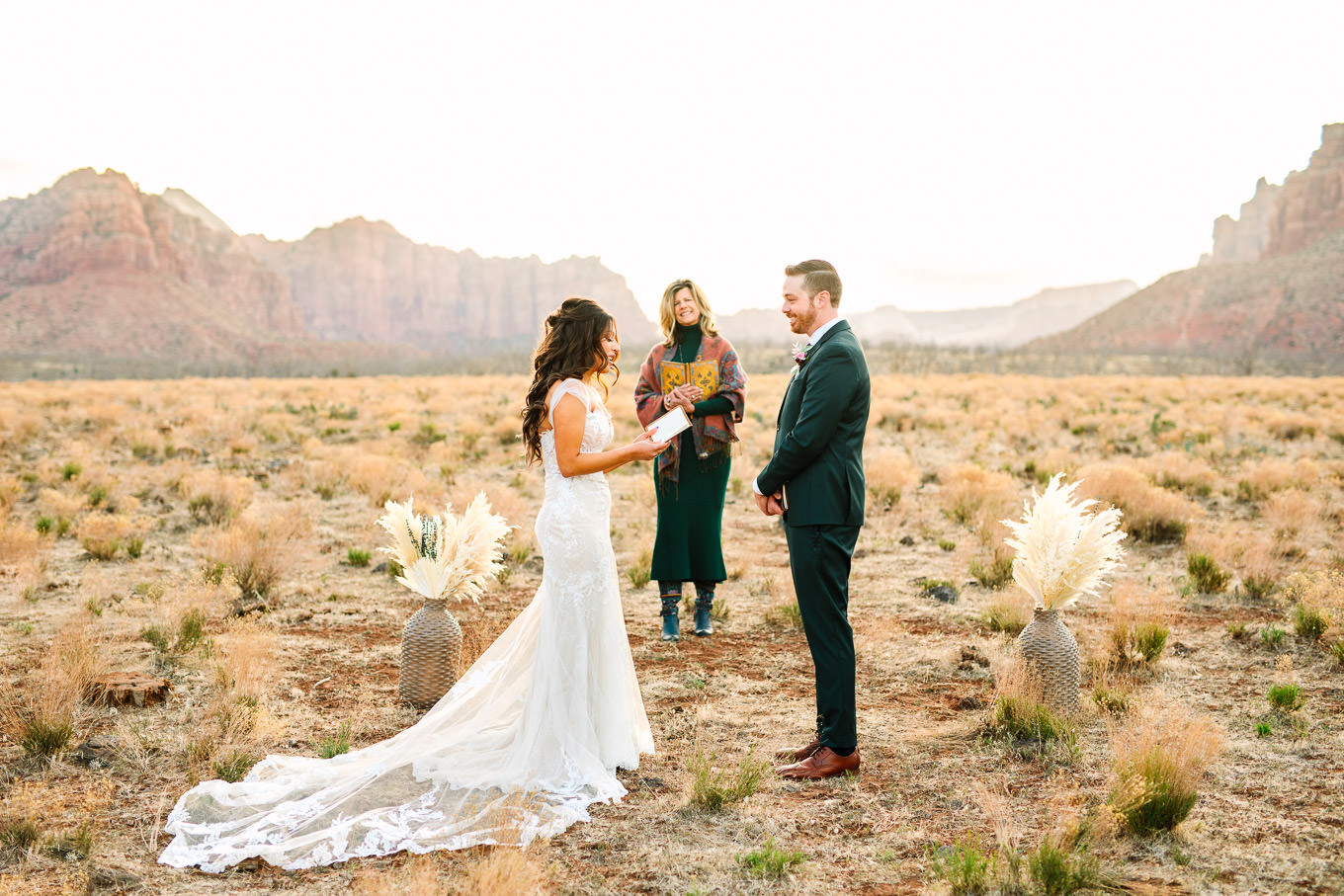 Bride reading vows | Zion Under Canvas camping elopement at sunrise | Colorful elopement photography | #utahelopement #zionelopement #zionwedding #undercanvaszion #sunriseelopement #adventureelopement  Source: Mary Costa Photography | Los Angeles