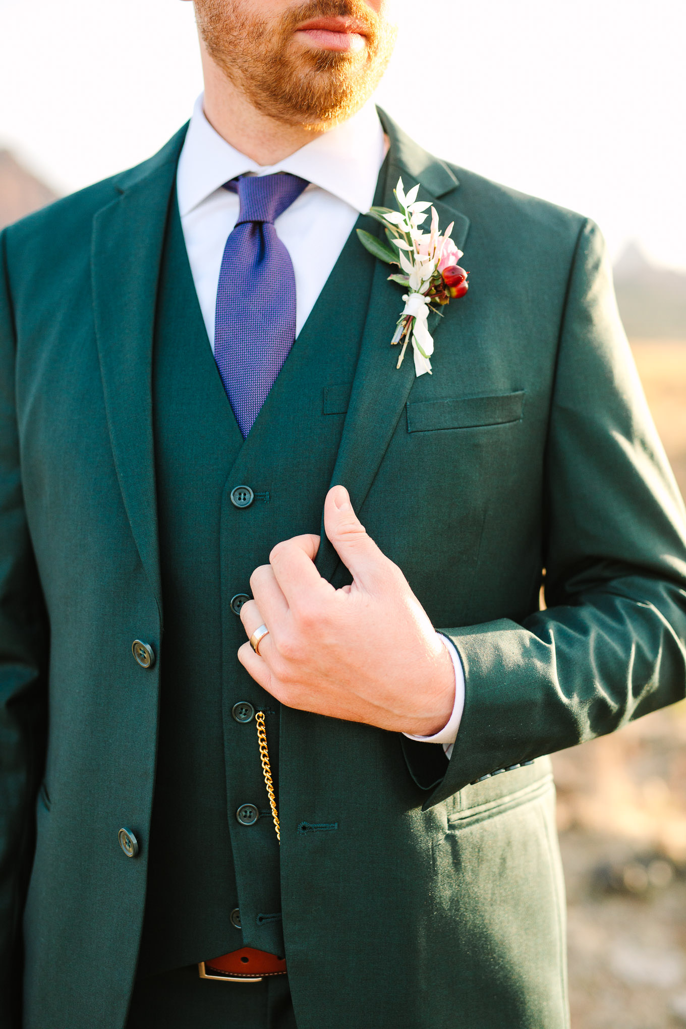Groom portrait in green suit | Zion Under Canvas camping elopement at sunrise | Colorful elopement photography | #utahelopement #zionelopement #zionwedding #undercanvaszion #sunriseelopement #adventureelopement  Source: Mary Costa Photography | Los Angeles