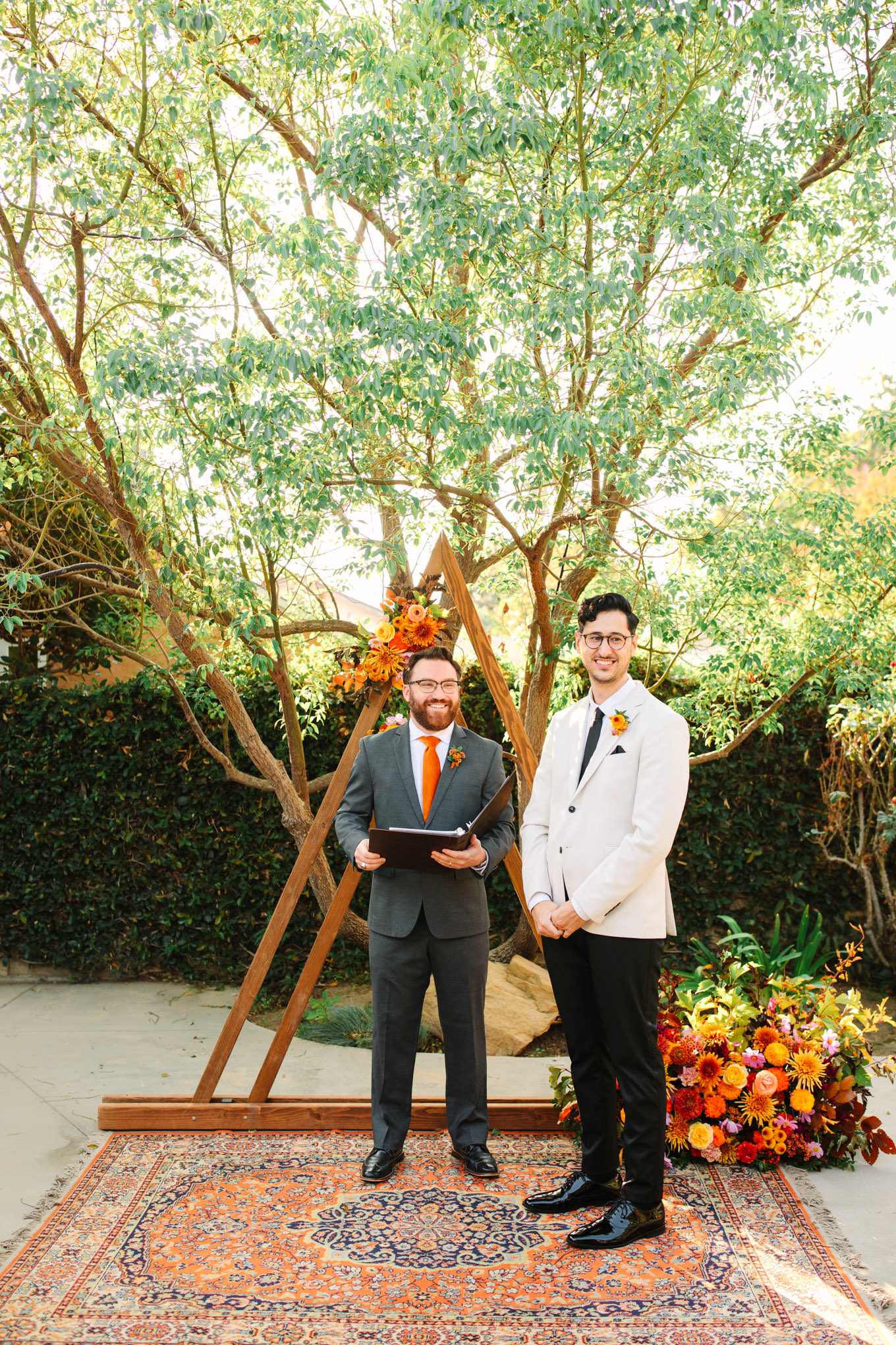 Groom at alter waiting for bride | Vibrant backyard micro wedding featured on Green Wedding Shoes | Colorful LA wedding photography | #losangeleswedding #backyardwedding #microwedding #laweddingphotographer Source: Mary Costa Photography | Los Angeles