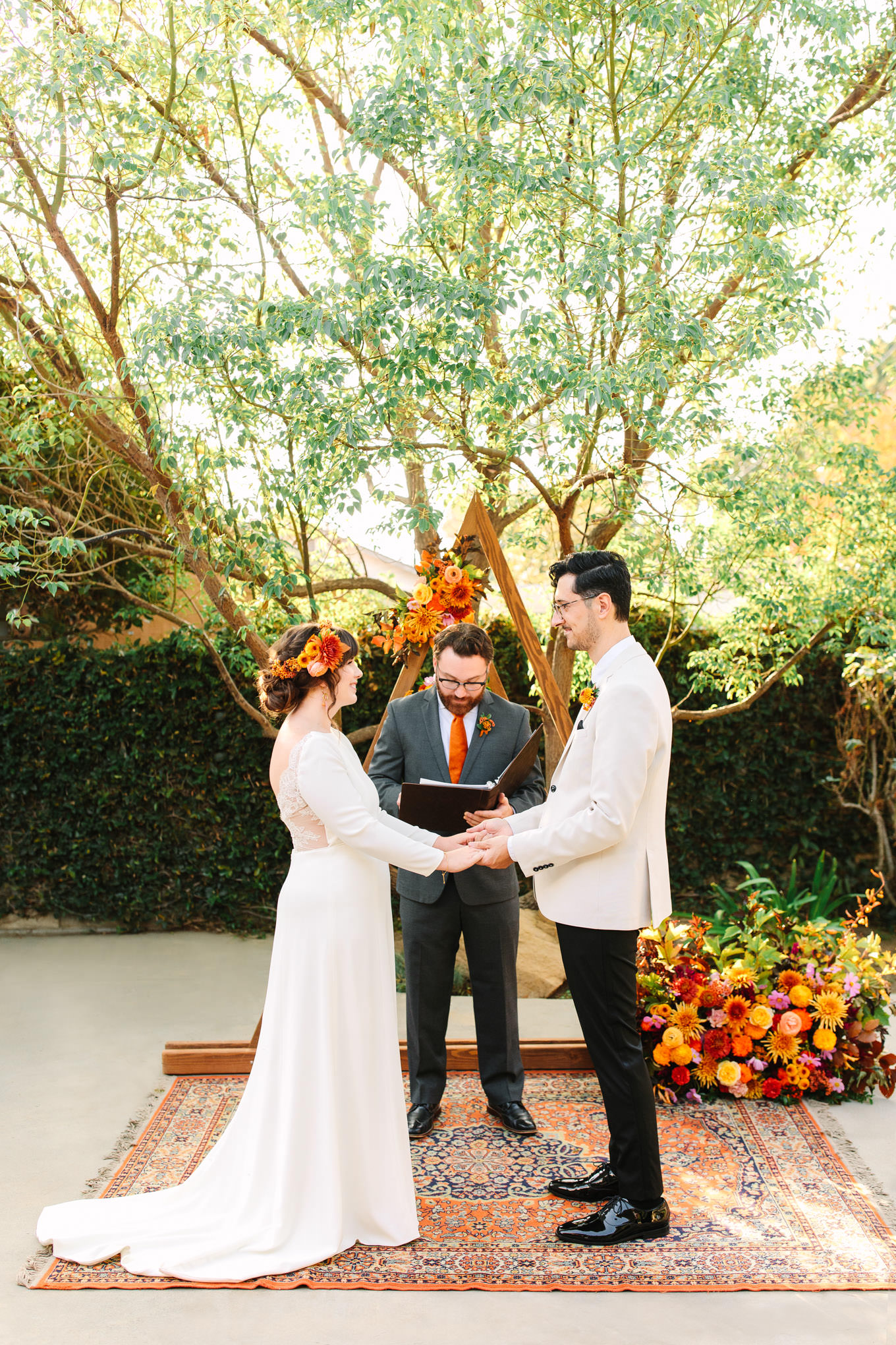 Ceremony photo with unique backdrop | Vibrant backyard micro wedding featured on Green Wedding Shoes | Colorful LA wedding photography | #losangeleswedding #backyardwedding #microwedding #laweddingphotographer Source: Mary Costa Photography | Los Angeles