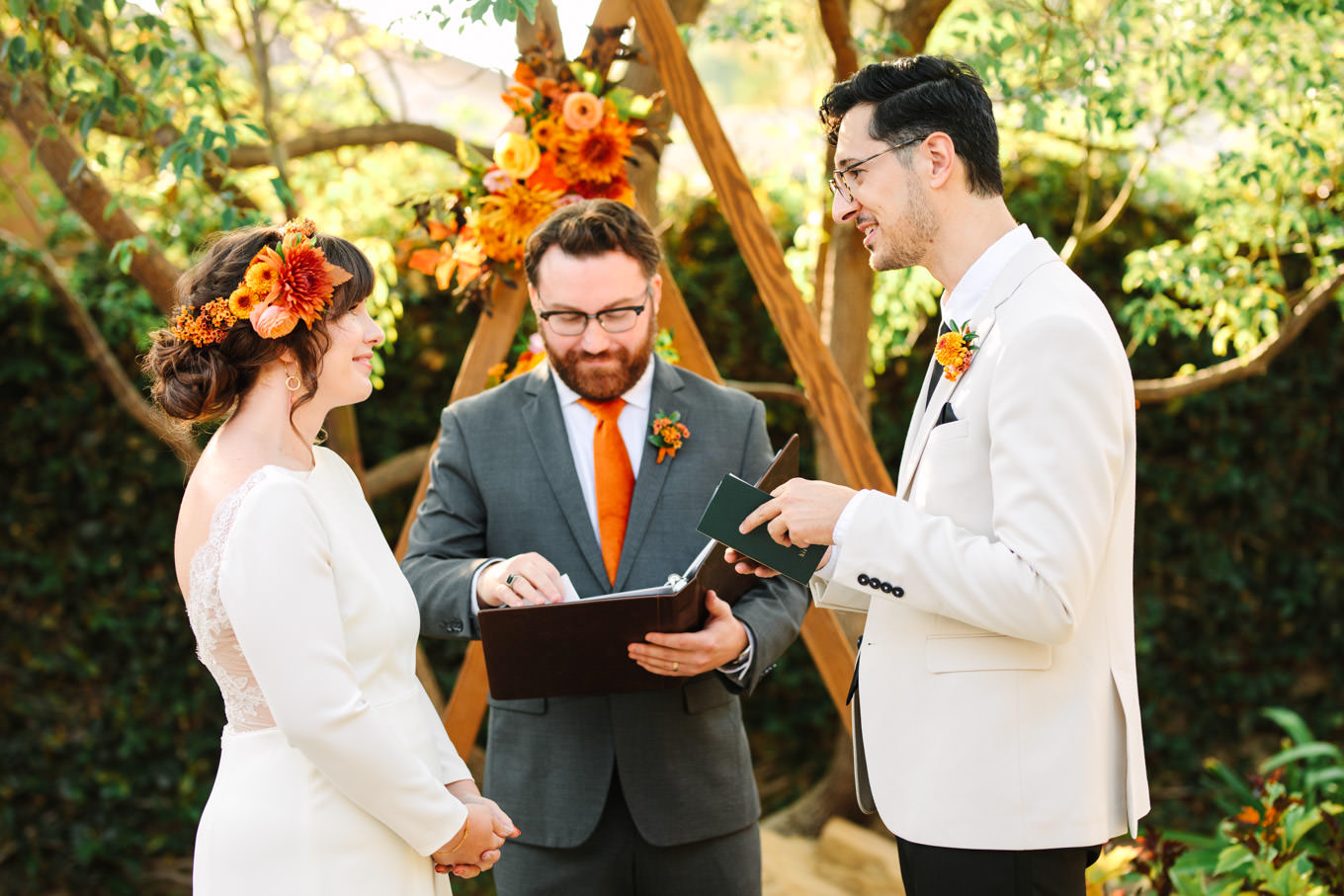 Groom and bride while reading vows | Vibrant backyard micro wedding featured on Green Wedding Shoes | Colorful LA wedding photography | #losangeleswedding #backyardwedding #microwedding #laweddingphotographer Source: Mary Costa Photography | Los Angeles