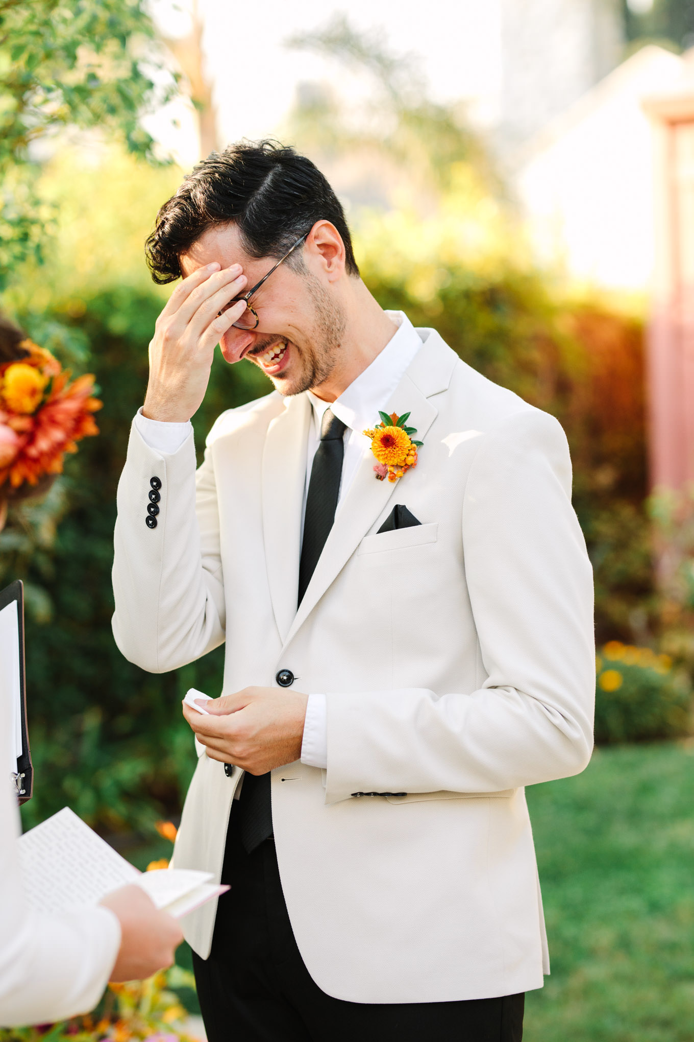 Grooms reaction while reading personal vows | Vibrant backyard micro wedding featured on Green Wedding Shoes | Colorful LA wedding photography | #losangeleswedding #backyardwedding #microwedding #laweddingphotographer Source: Mary Costa Photography | Los Angeles