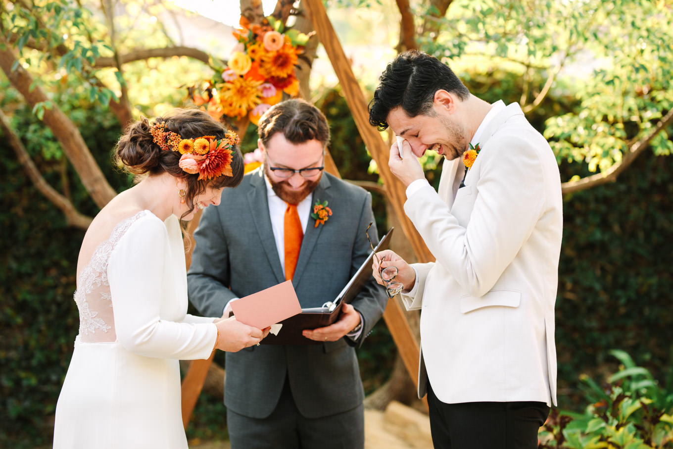 Bride and groom in prayer | Vibrant backyard micro wedding featured on Green Wedding Shoes | Colorful LA wedding photography | #losangeleswedding #backyardwedding #microwedding #laweddingphotographer Source: Mary Costa Photography | Los Angeles
