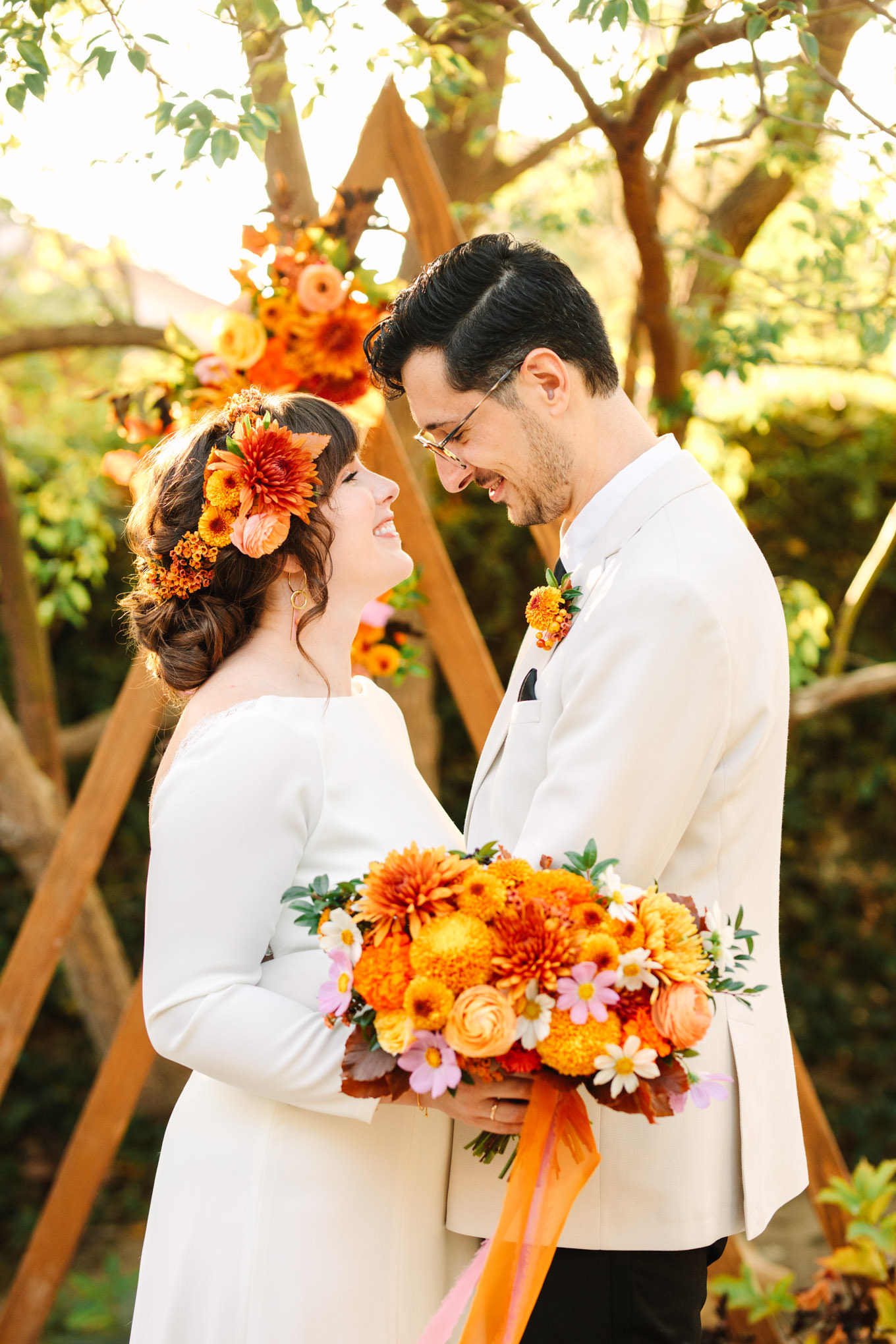 Close up portrait with unique wedding ceremony backdrop | Vibrant backyard micro wedding featured on Green Wedding Shoes | Colorful LA wedding photography | #losangeleswedding #backyardwedding #microwedding #laweddingphotographer Source: Mary Costa Photography | Los Angeles