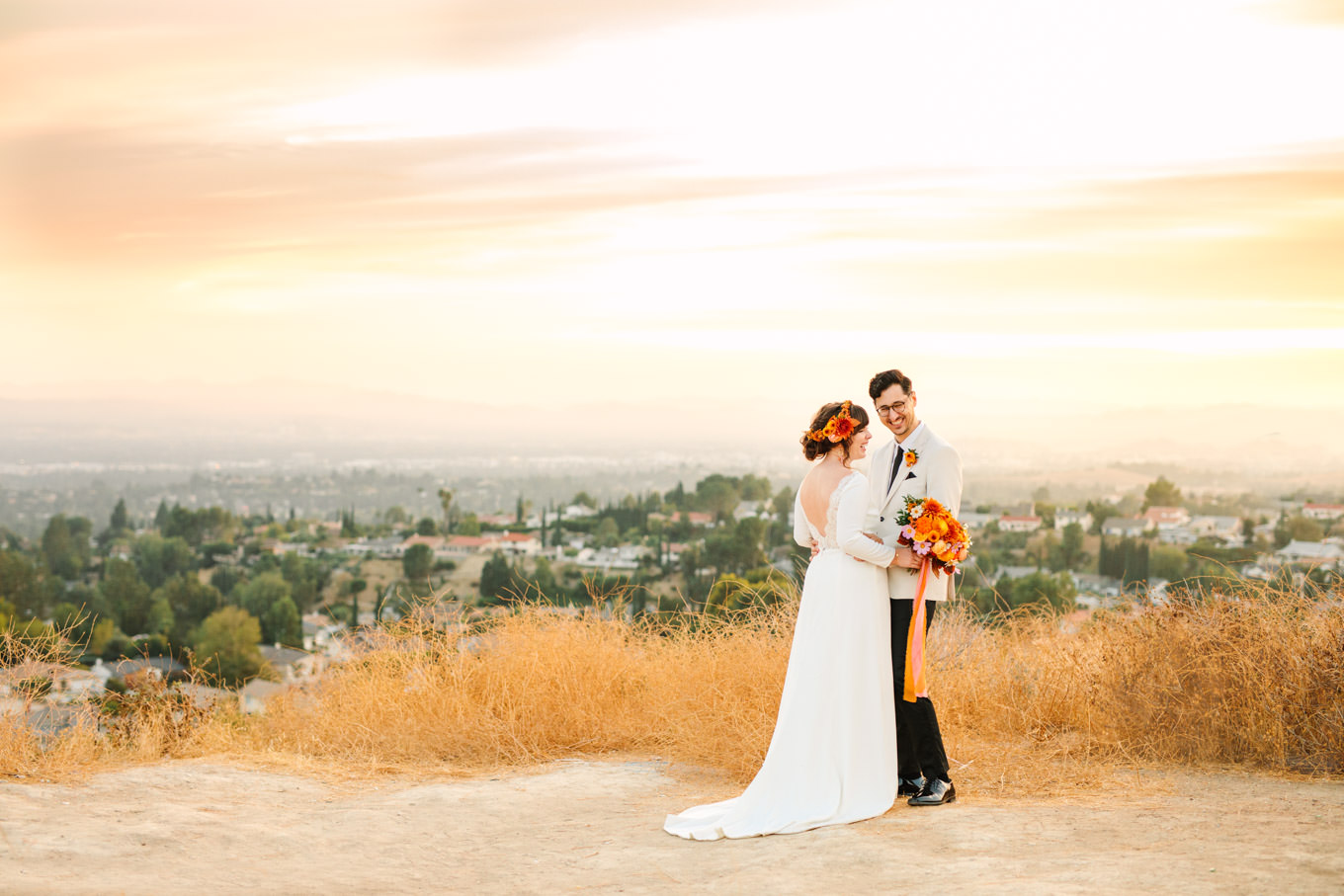 Bride and groom with striking outdoor backdrop | Vibrant backyard micro wedding featured on Green Wedding Shoes | Colorful LA wedding photography | #losangeleswedding #backyardwedding #microwedding #laweddingphotographer Source: Mary Costa Photography | Los Angeles