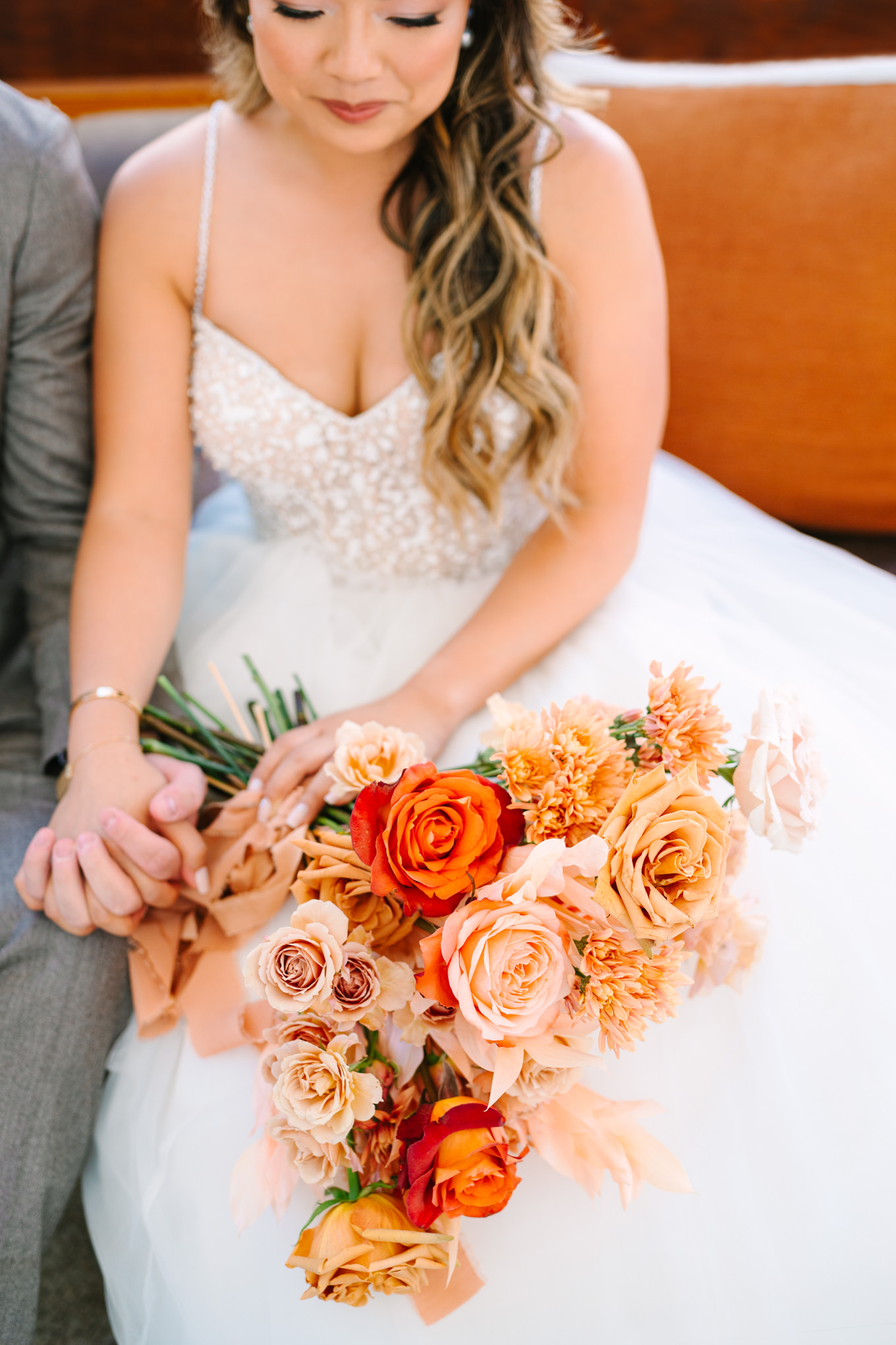 Close up of orange and pink bridal bouquet | Pink and orange Lautner Compound wedding | Colorful Palm Springs wedding photography | #palmspringsphotographer #palmspringswedding #lautnercompound #southerncaliforniawedding  Source: Mary Costa Photography | Los Angeles
