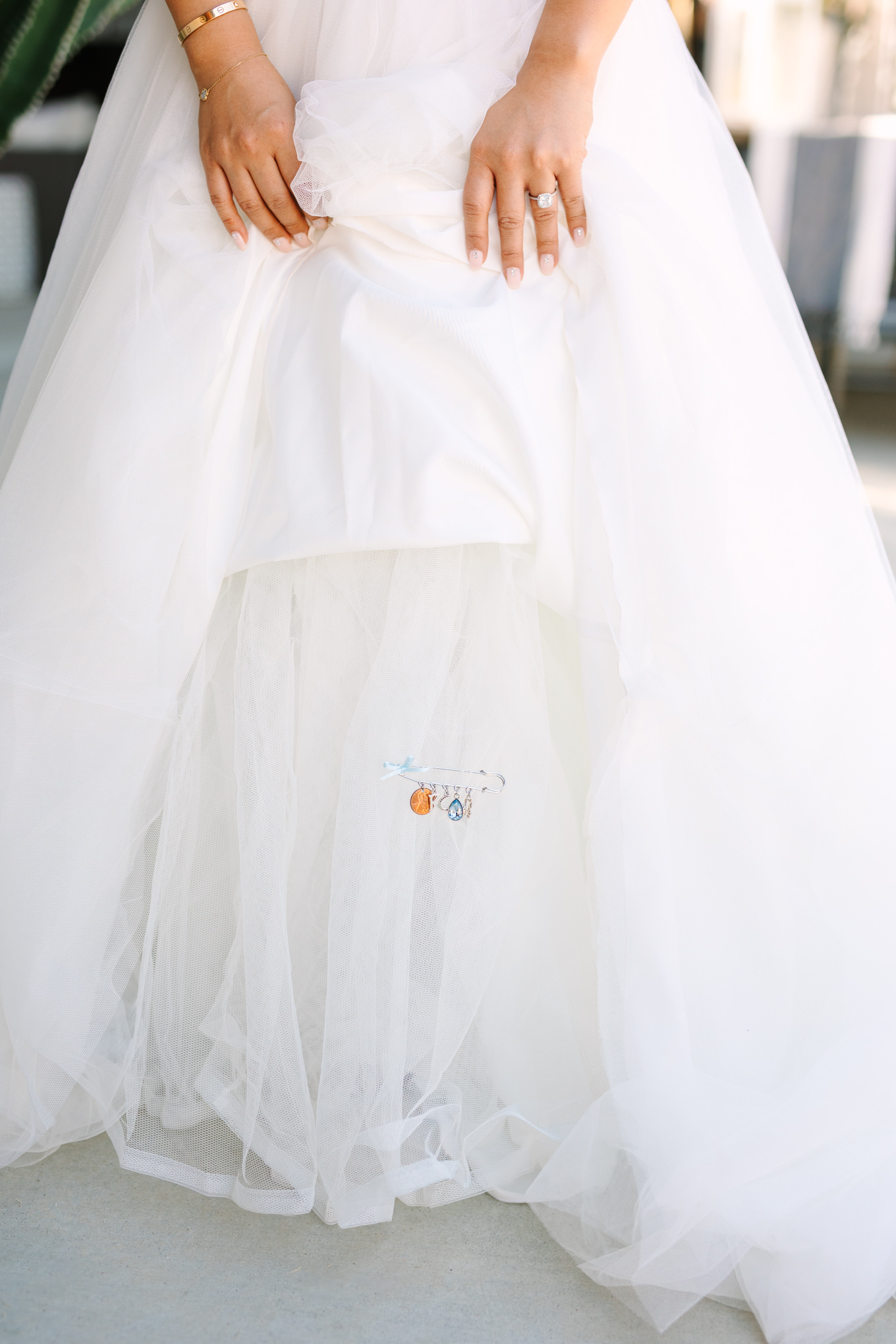 Special pin on bridal gown | Pink and orange Lautner Compound wedding | Colorful Palm Springs wedding photography | #palmspringsphotographer #palmspringswedding #lautnercompound #southerncaliforniawedding  Source: Mary Costa Photography | Los Angeles