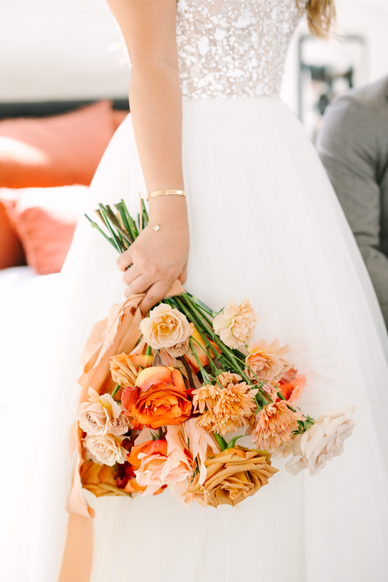 Orange and peach bridal bouquet | Pink and orange Lautner Compound wedding | Colorful Palm Springs wedding photography | #palmspringsphotographer #palmspringswedding #lautnercompound #southerncaliforniawedding  Source: Mary Costa Photography | Los Angeles