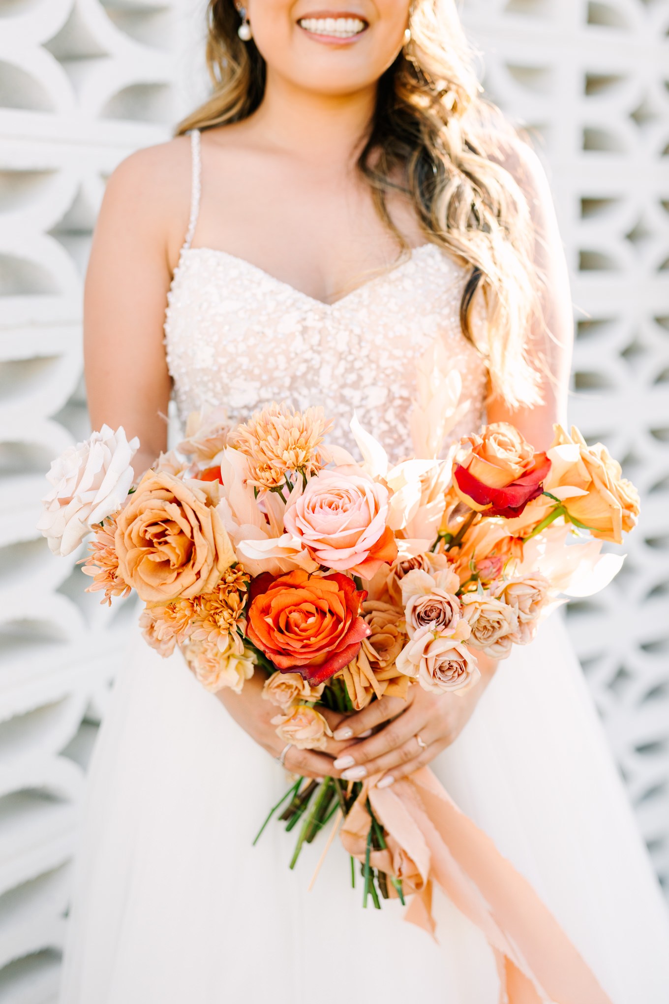 Orange, peach and yellow bridal bouquet | Pink and orange Lautner Compound wedding | Colorful Palm Springs wedding photography | #palmspringsphotographer #palmspringswedding #lautnercompound #southerncaliforniawedding  Source: Mary Costa Photography | Los Angeles