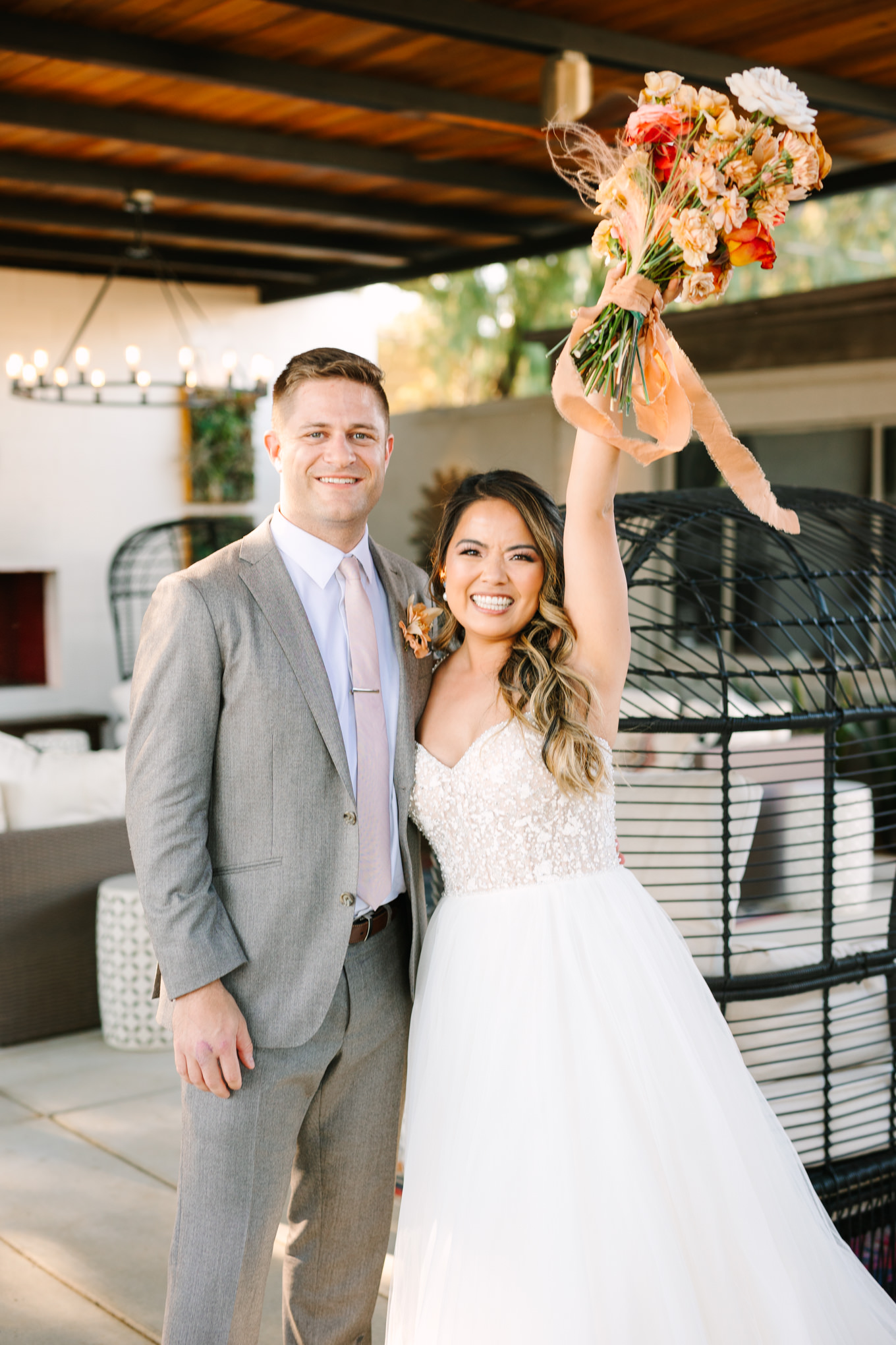 Bride and groom right after ceremony | Pink and orange Lautner Compound wedding | Colorful Palm Springs wedding photography | #palmspringsphotographer #palmspringswedding #lautnercompound #southerncaliforniawedding  Source: Mary Costa Photography | Los Angeles
