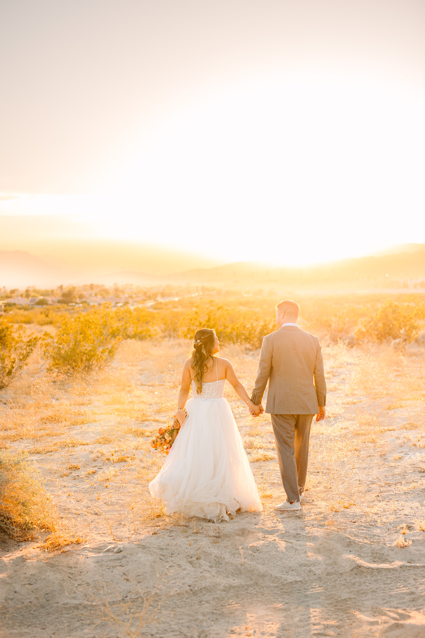 Desert sunset portrait | Pink and orange Lautner Compound wedding | Colorful Palm Springs wedding photography | #palmspringsphotographer #palmspringswedding #lautnercompound #southerncaliforniawedding  Source: Mary Costa Photography | Los Angeles
