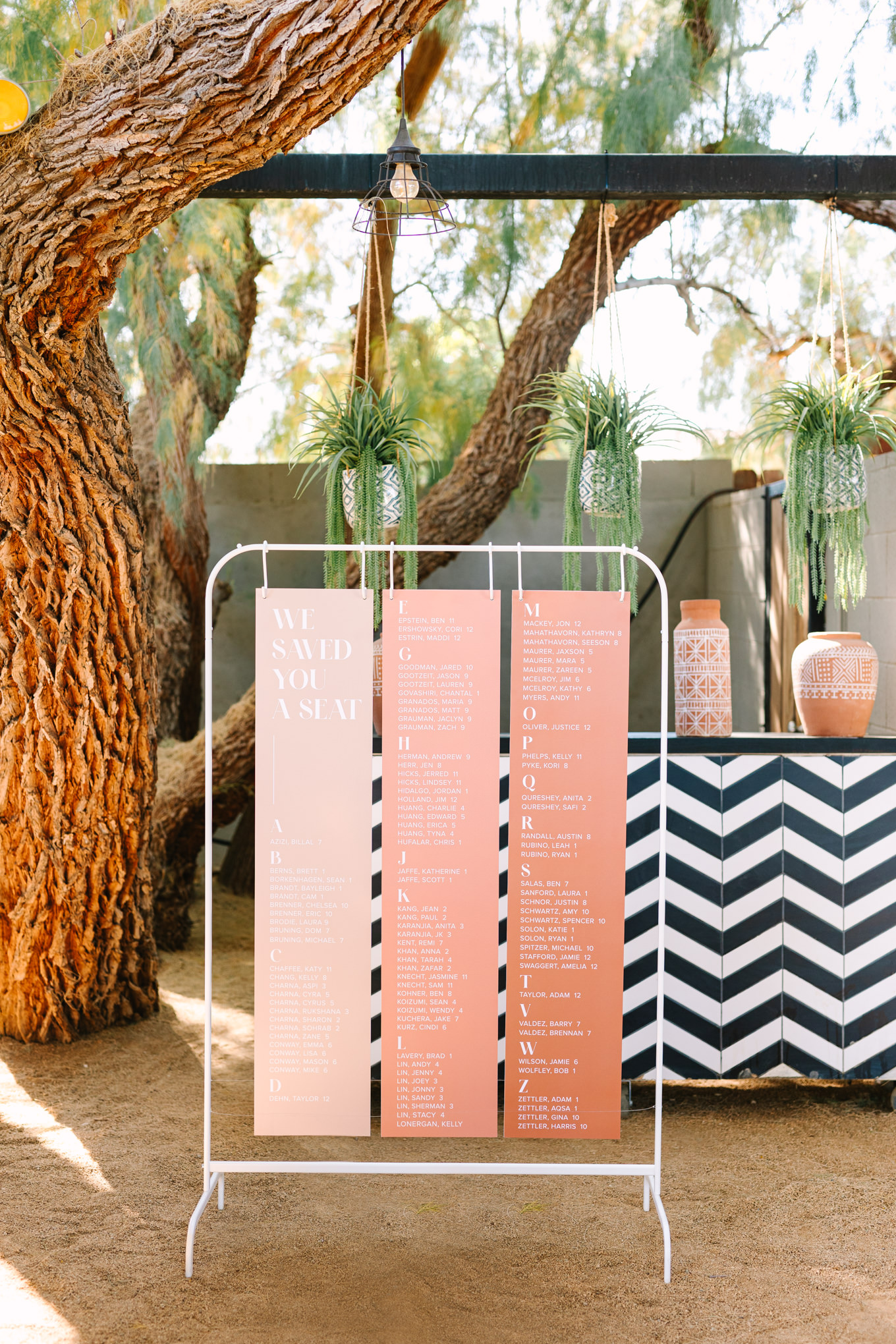 Ombre peach seating chart | Pink and orange Lautner Compound wedding | Colorful Palm Springs wedding photography | #palmspringsphotographer #palmspringswedding #lautnercompound #southerncaliforniawedding  Source: Mary Costa Photography | Los Angeles
