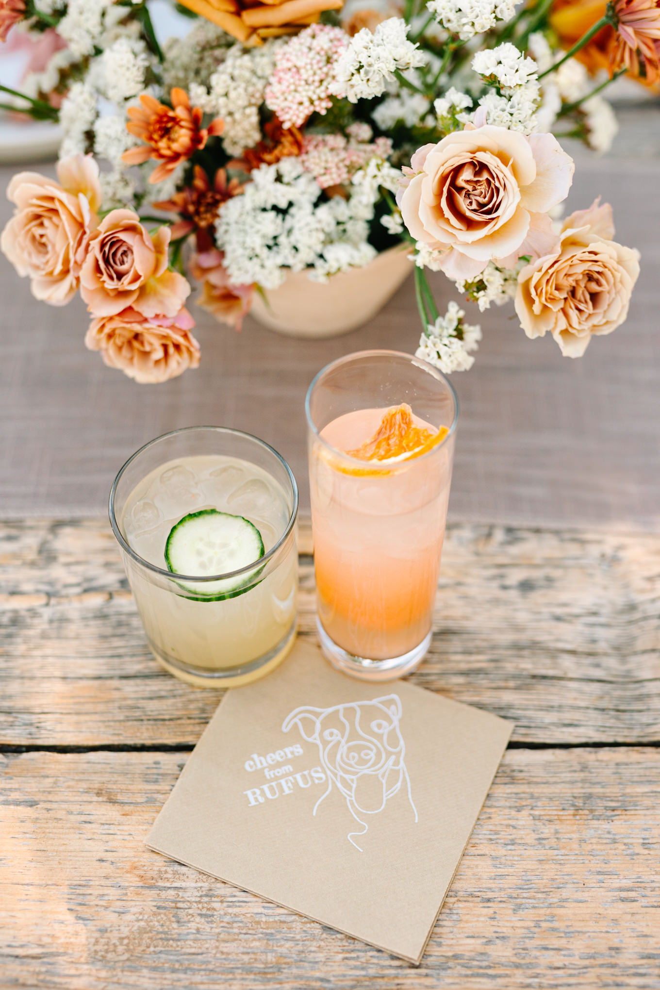 Signature cocktails with napkin | Pink and orange Lautner Compound wedding | Colorful Palm Springs wedding photography | #palmspringsphotographer #palmspringswedding #lautnercompound #southerncaliforniawedding  Source: Mary Costa Photography | Los Angeles