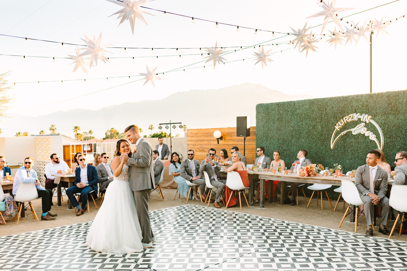 Bride and groom first dance | Pink and orange Lautner Compound wedding | Colorful Palm Springs wedding photography | #palmspringsphotographer #palmspringswedding #lautnercompound #southerncaliforniawedding  Source: Mary Costa Photography | Los Angeles