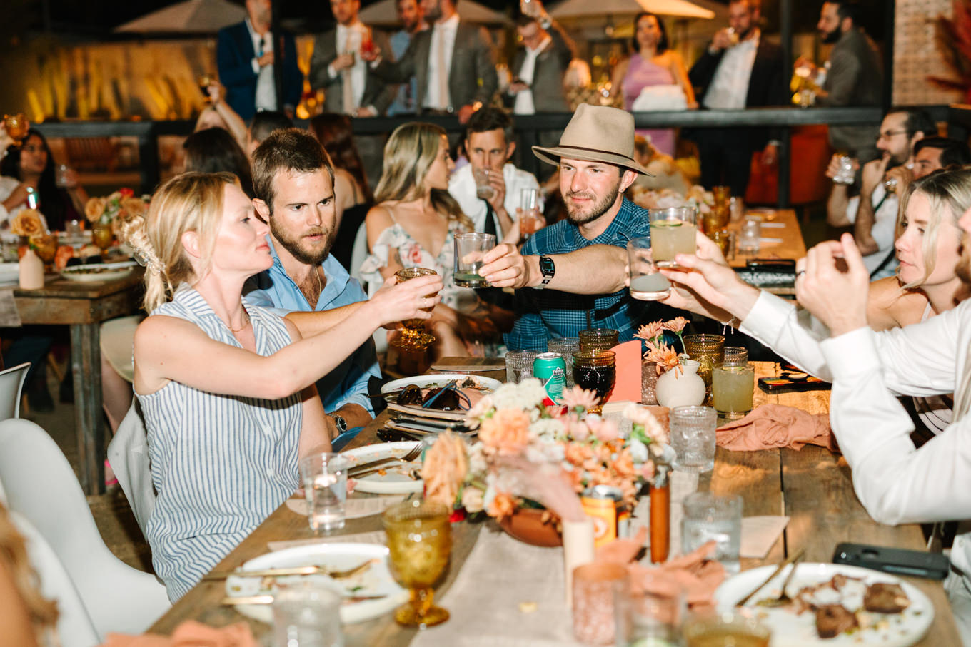 Toast at wedding reception | Pink and orange Lautner Compound wedding | Colorful Palm Springs wedding photography | #palmspringsphotographer #palmspringswedding #lautnercompound #southerncaliforniawedding  Source: Mary Costa Photography | Los Angeles