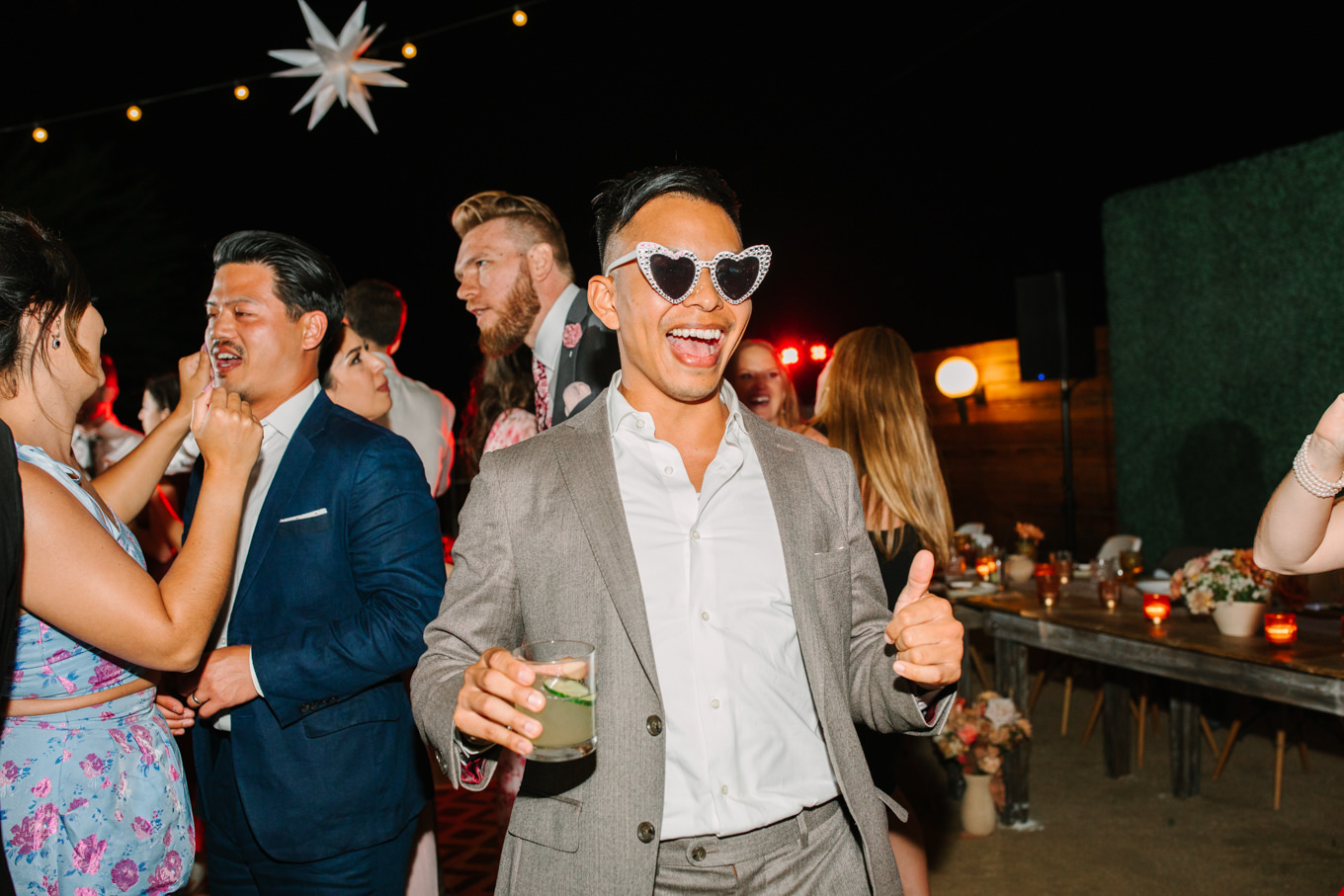Dancing at wedding reception | Pink and orange Lautner Compound wedding | Colorful Palm Springs wedding photography | #palmspringsphotographer #palmspringswedding #lautnercompound #southerncaliforniawedding  Source: Mary Costa Photography | Los Angeles