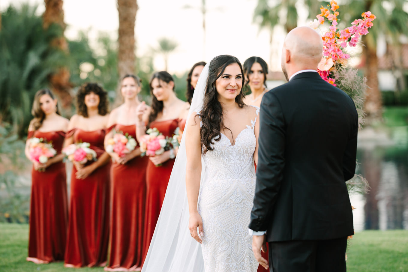 Couple during ceremony | Pink Bougainvillea Estate wedding | Colorful LA wedding photography | #bougainvilleaestate #palmspringswedding #palmspringsweddingvenue #palmspringsphotographer Source: Mary Costa Photography | Los Angeles