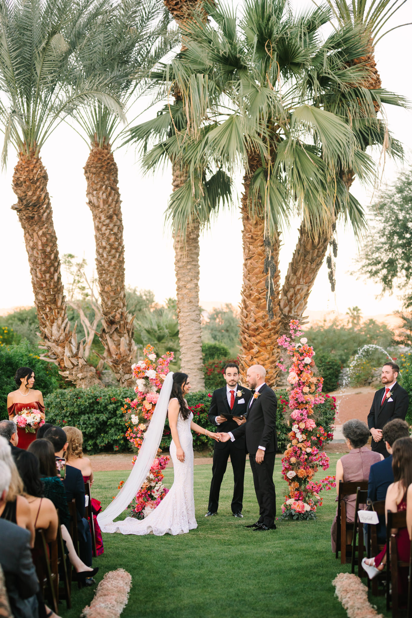 Wedding ceremony | Pink Bougainvillea Estate wedding | Colorful LA wedding photography | #bougainvilleaestate #palmspringswedding #palmspringsweddingvenue #palmspringsphotographer Source: Mary Costa Photography | Los Angeles