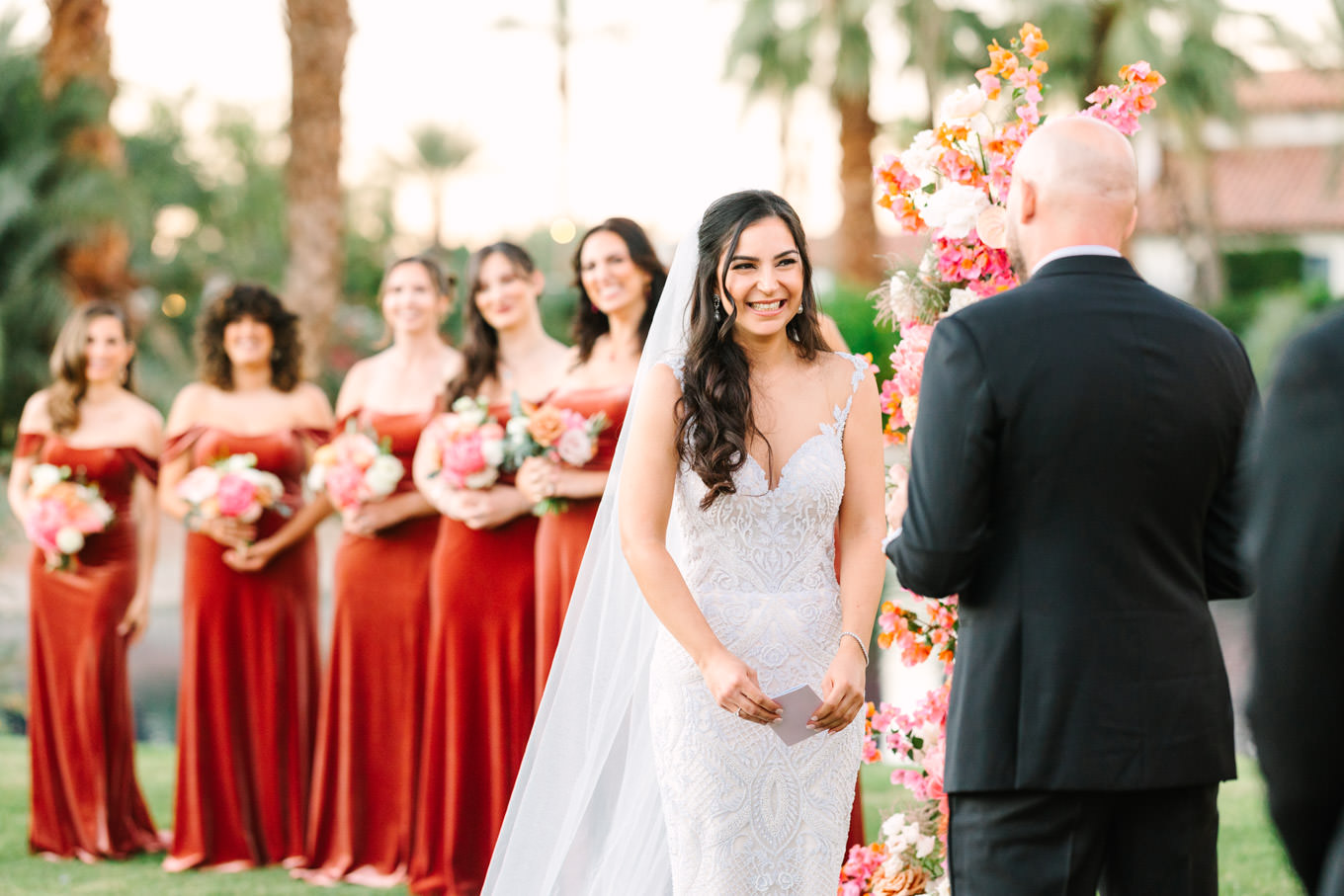 Couple exchanging vows | Pink Bougainvillea Estate wedding | Colorful LA wedding photography | #bougainvilleaestate #palmspringswedding #palmspringsweddingvenue #palmspringsphotographer Source: Mary Costa Photography | Los Angeles