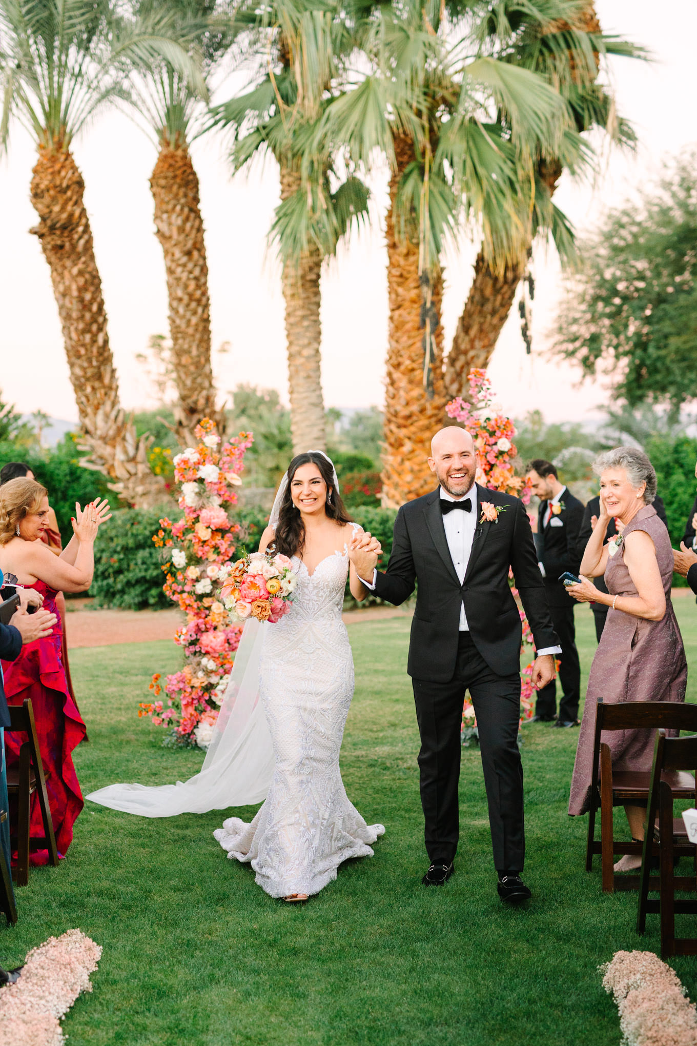 Couples walk down the aisle | Pink Bougainvillea Estate wedding | Colorful LA wedding photography | #bougainvilleaestate #palmspringswedding #palmspringsweddingvenue #palmspringsphotographer Source: Mary Costa Photography | Los Angeles