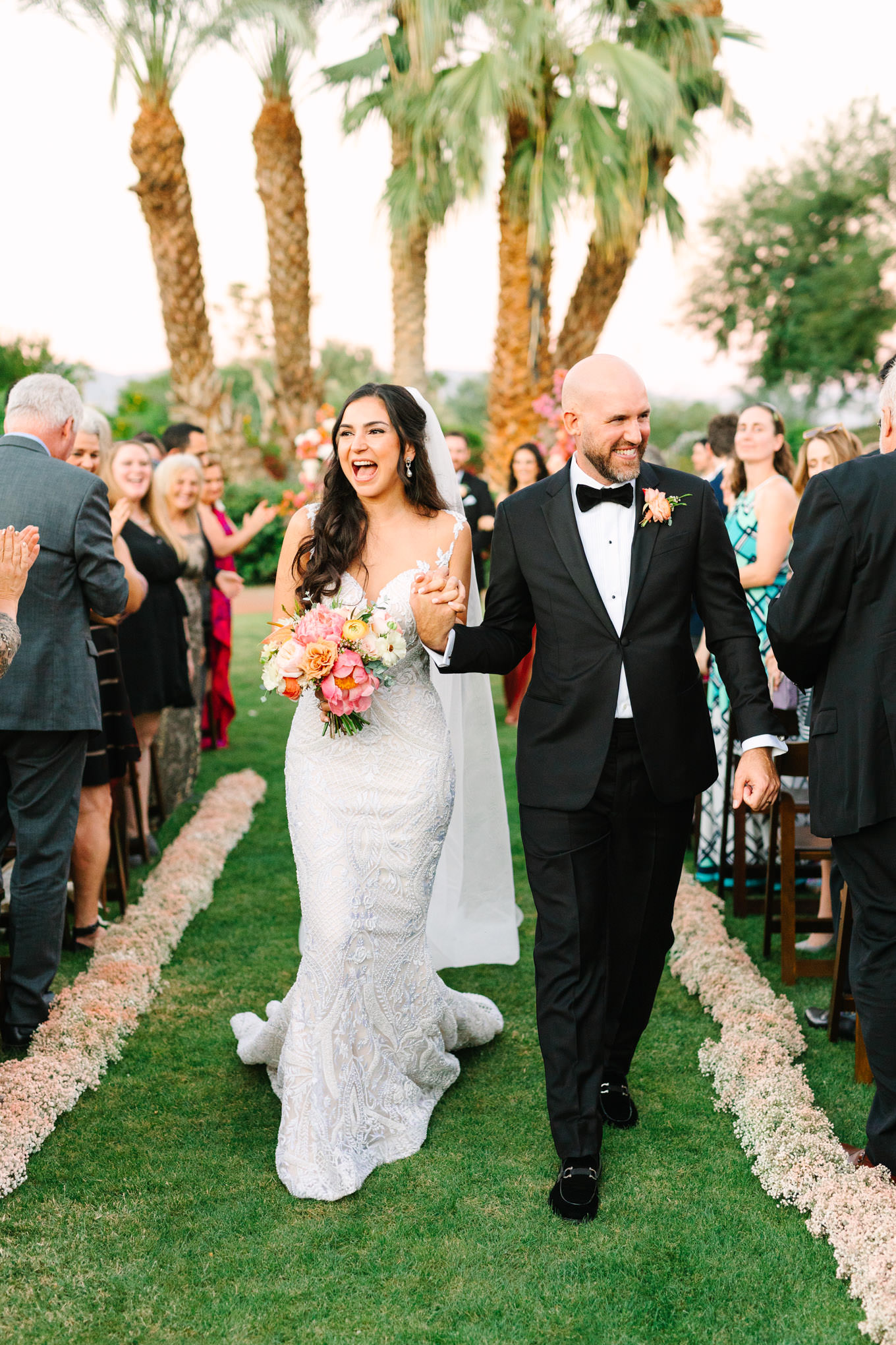 Couple after ceremony | Pink Bougainvillea Estate wedding | Colorful LA wedding photography | #bougainvilleaestate #palmspringswedding #palmspringsweddingvenue #palmspringsphotographer Source: Mary Costa Photography | Los Angeles