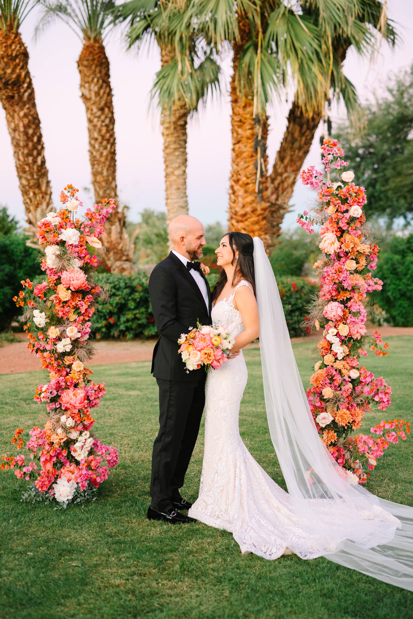 Bride and Groom at the altar | Pink Bougainvillea Estate wedding | Colorful LA wedding photography | #bougainvilleaestate #palmspringswedding #palmspringsweddingvenue #palmspringsphotographer Source: Mary Costa Photography | Los Angeles