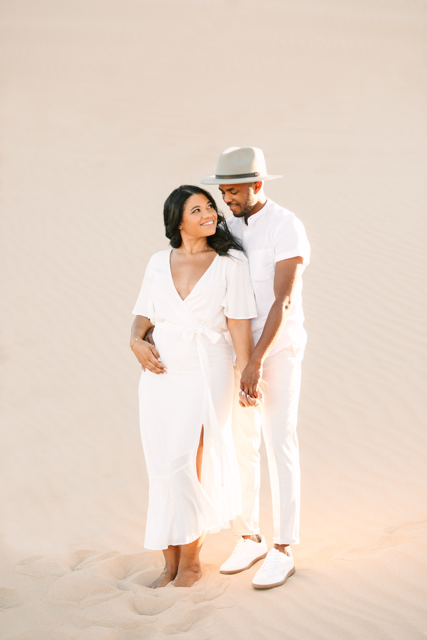 Bride to be gazing at her husband to be | California Sand Dunes engagement session | Colorful Palm Springs wedding photography | #palmspringsphotographer #sanddunes #engagementsession #southerncalifornia  Source: Mary Costa Photography | Los Angeles