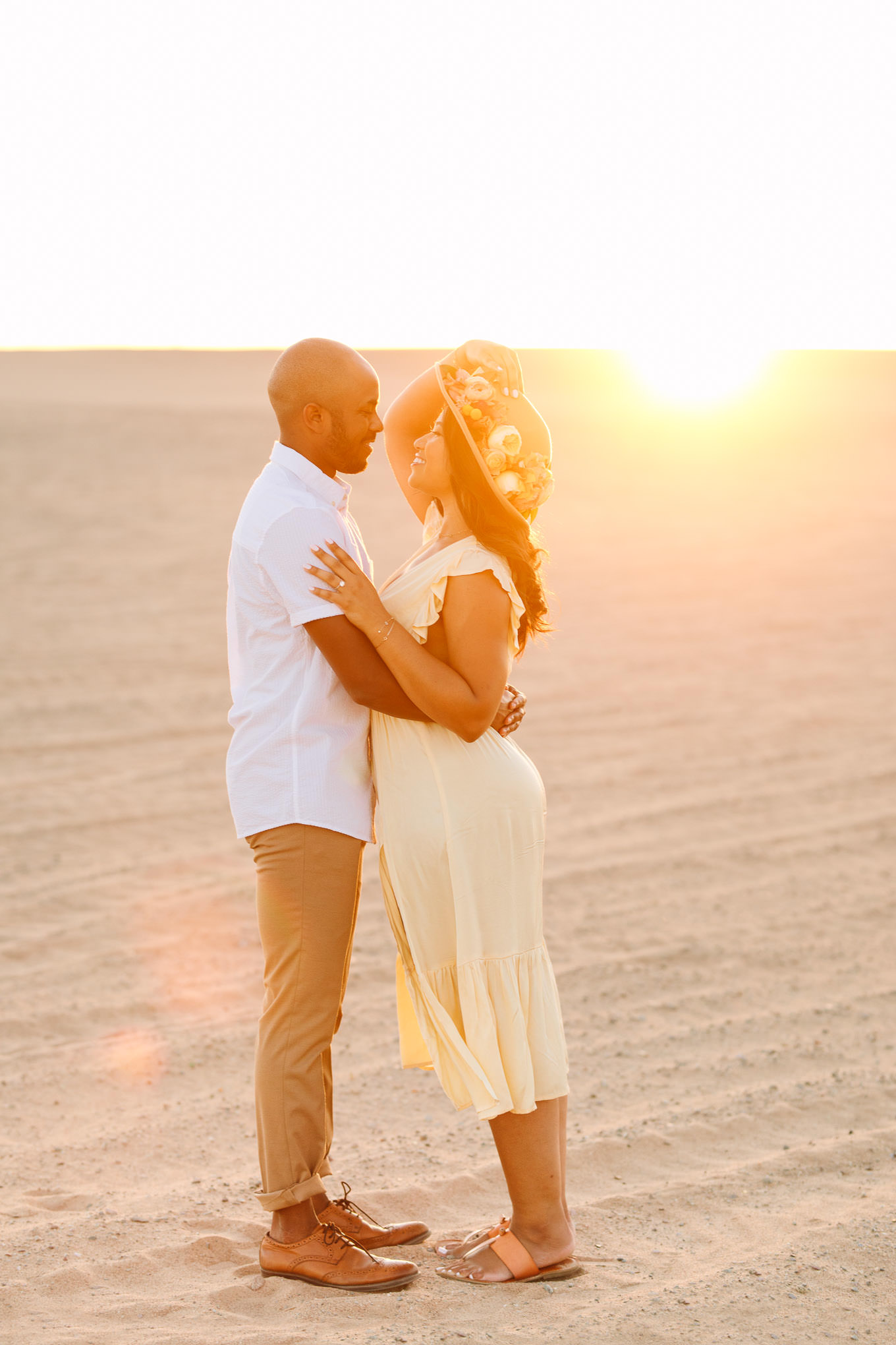 Golden hour photo of engaged couple on sand dune | California Sand Dunes engagement session | Colorful Palm Springs wedding photography | #palmspringsphotographer #sanddunes #engagementsession #southerncalifornia  Source: Mary Costa Photography | Los Angeles