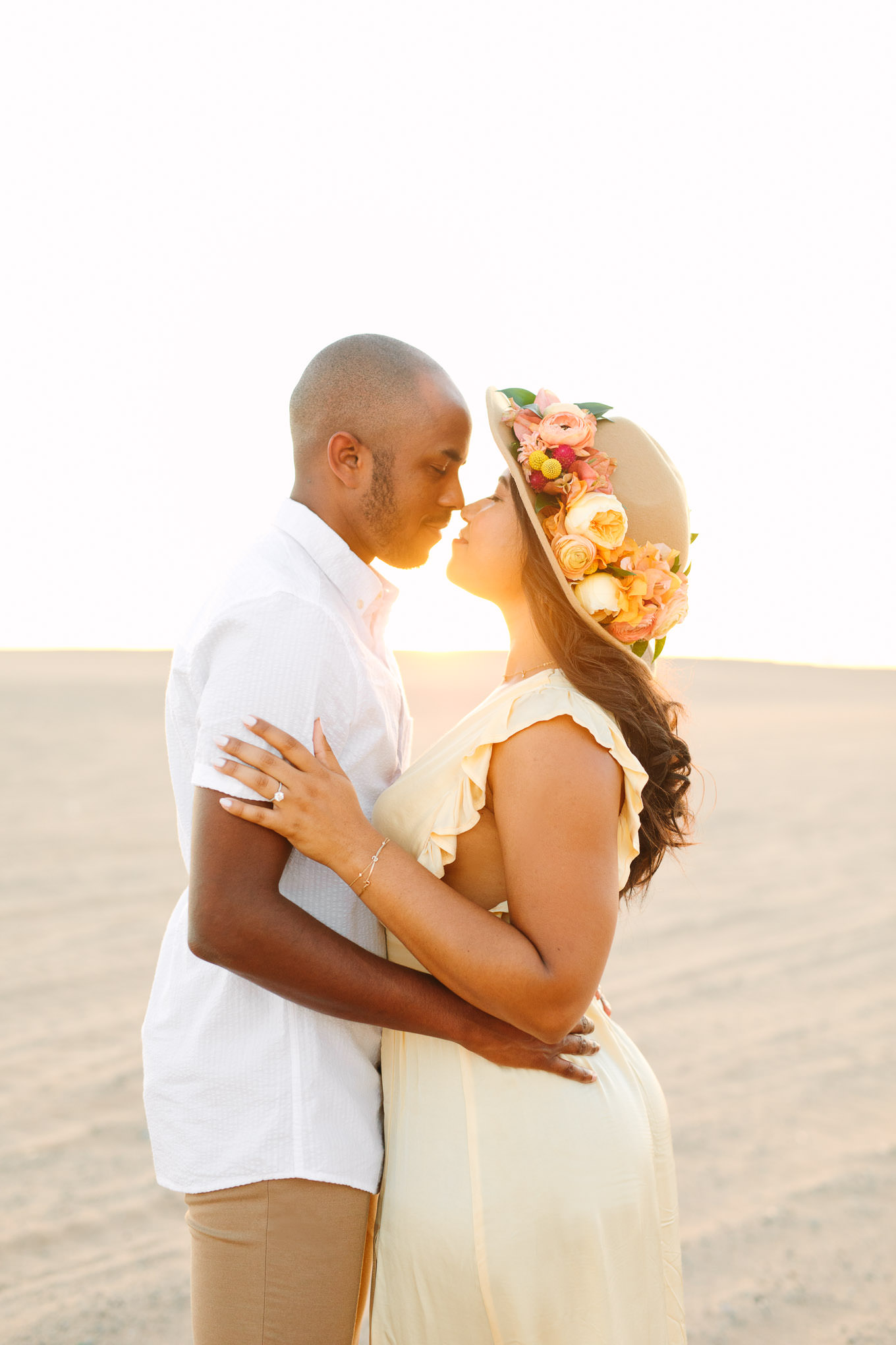 Golden hour photo of engaged couple on sand dune | California Sand Dunes engagement session | Colorful Palm Springs wedding photography | #palmspringsphotographer #sanddunes #engagementsession #southerncalifornia  Source: Mary Costa Photography | Los Angeles