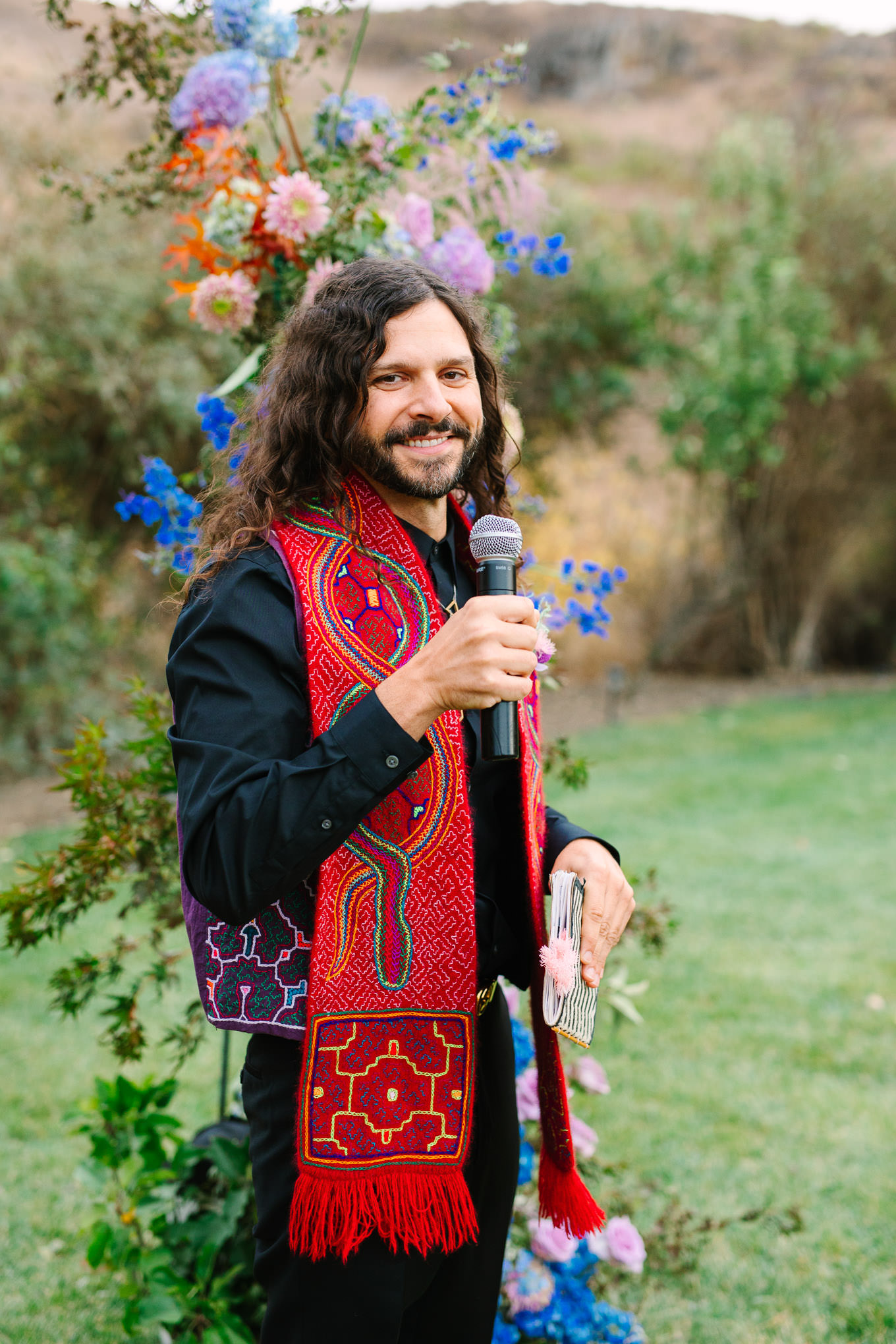 Wedding officiant at ceremony | Colorful and quirky wedding at Higuera Ranch in San Luis Obispo | #sanluisobispowedding #californiawedding #higueraranch #madonnainn   
Source: Mary Costa Photography | Los Angeles