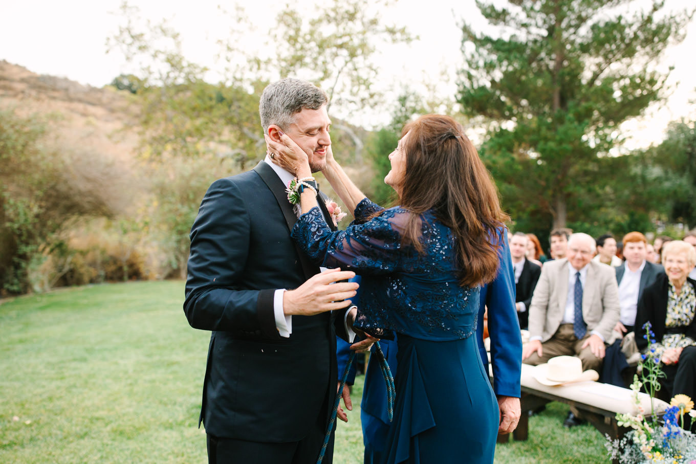 Groom with his mom at wedding ceremony | Colorful and quirky wedding at Higuera Ranch in San Luis Obispo | #sanluisobispowedding #californiawedding #higueraranch #madonnainn   
Source: Mary Costa Photography | Los Angeles