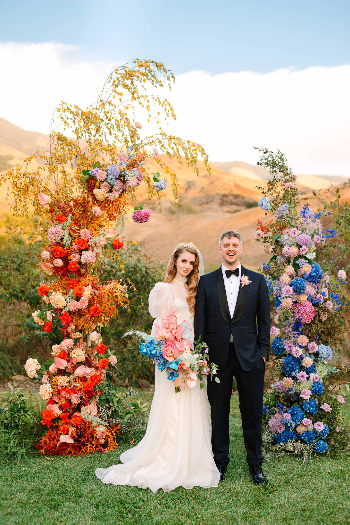 Allison Harvard & Jeremy Burke portraits at floral wedding ceremony installation | Colorful and quirky wedding at Higuera Ranch in San Luis Obispo | #sanluisobispowedding #californiawedding #higueraranch #madonnainn   Source: Mary Costa Photography | Los Angeles