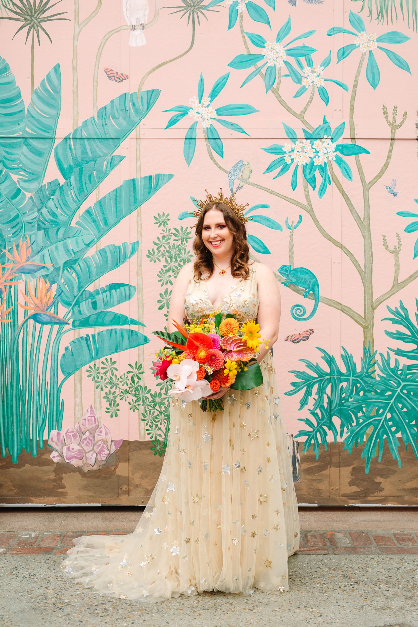 Bride with colorful tropical bouquet standing in front of mural | Colorful Downtown Los Angeles Valentine Wedding | Los Angeles wedding photographer | #losangeleswedding #colorfulwedding #DTLA #valentinedtla   Source: Mary Costa Photography | Los Angeles