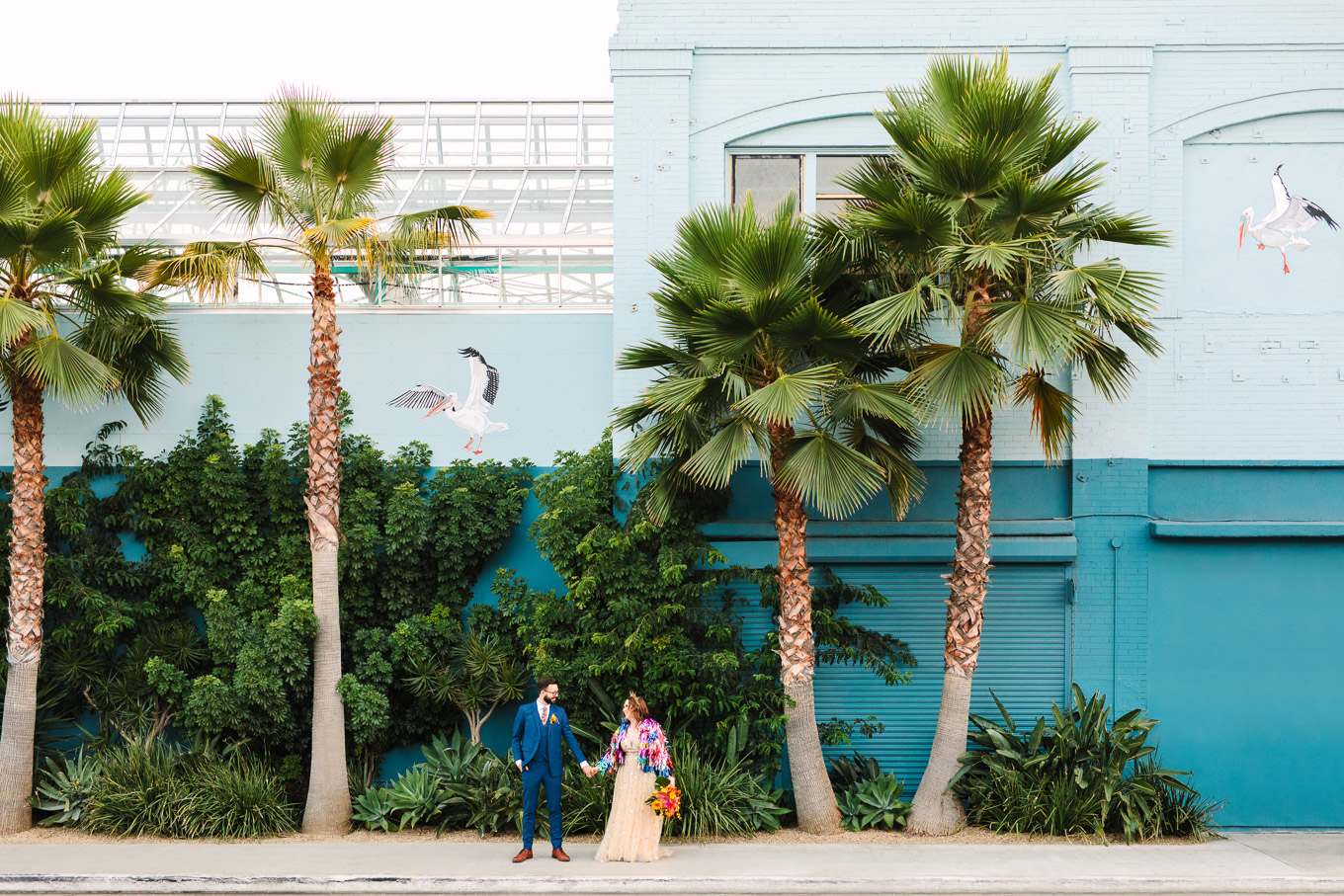 Colorful bride and groom in front of exterior of Valentine in DTLA | Colorful Downtown Los Angeles Valentine Wedding | Los Angeles wedding photographer | #losangeleswedding #colorfulwedding #DTLA #valentinedtla   Source: Mary Costa Photography | Los Angeles