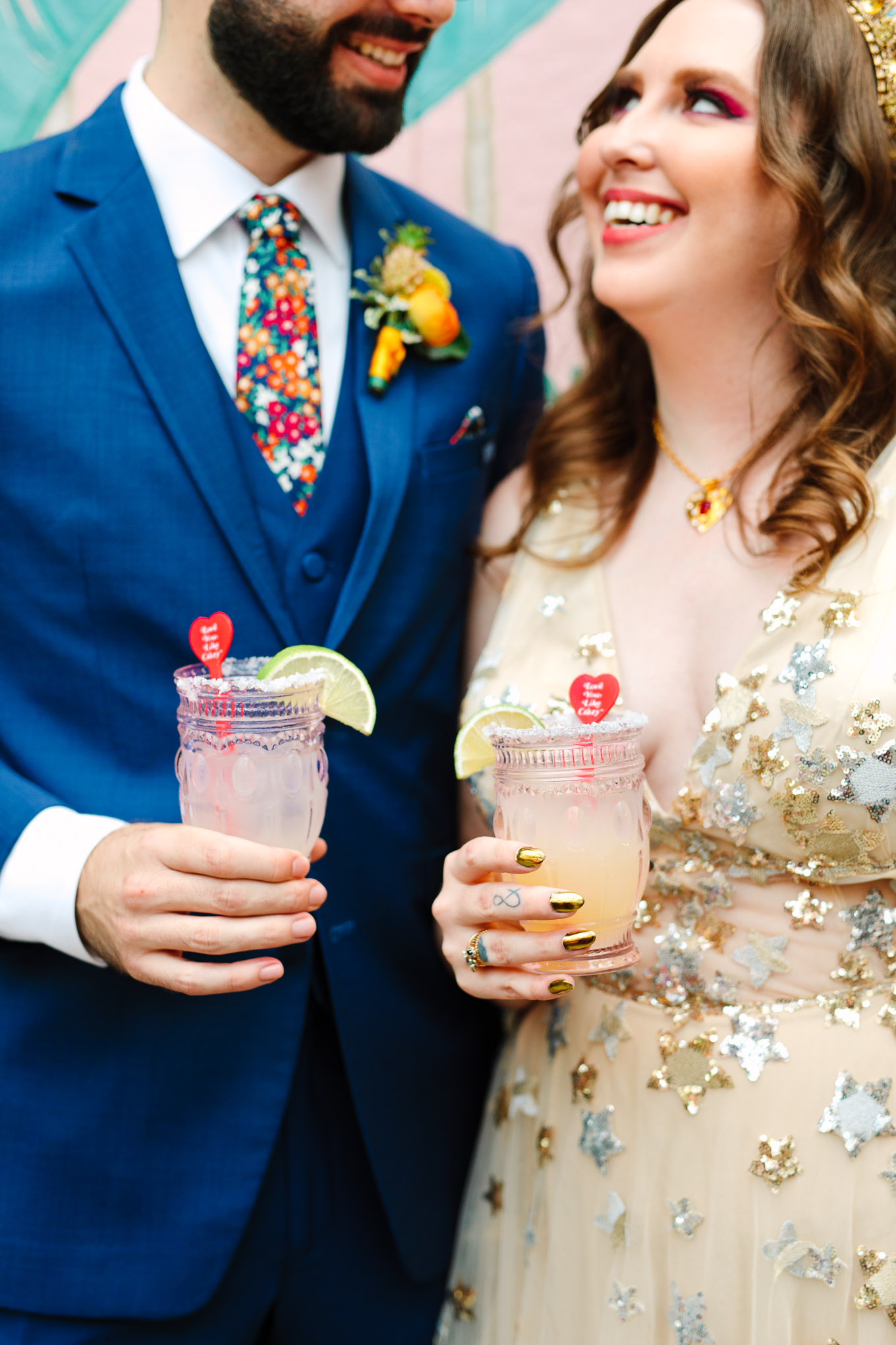 Bride and groom holding signature cocktails | Colorful Downtown Los Angeles Valentine Wedding | Los Angeles wedding photographer | #losangeleswedding #colorfulwedding #DTLA #valentinedtla   Source: Mary Costa Photography | Los Angeles